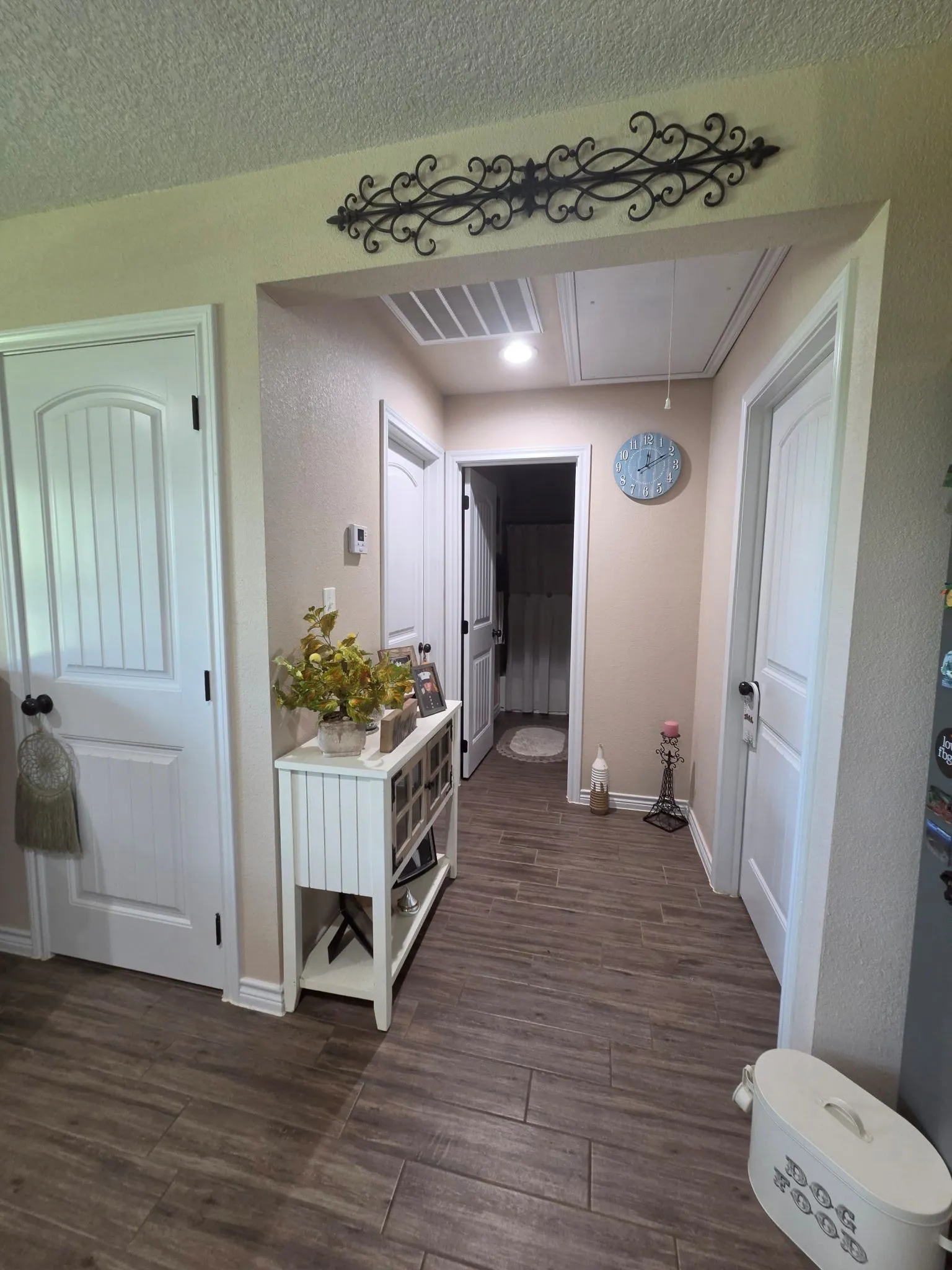 Hallway in LR leading to secondary bedrooms and bath