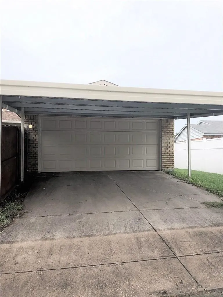 A portion of the garage was taken in to give the primary closet more space.  It will still fit a small car or smart car.  The carport covers two additional parking spaces