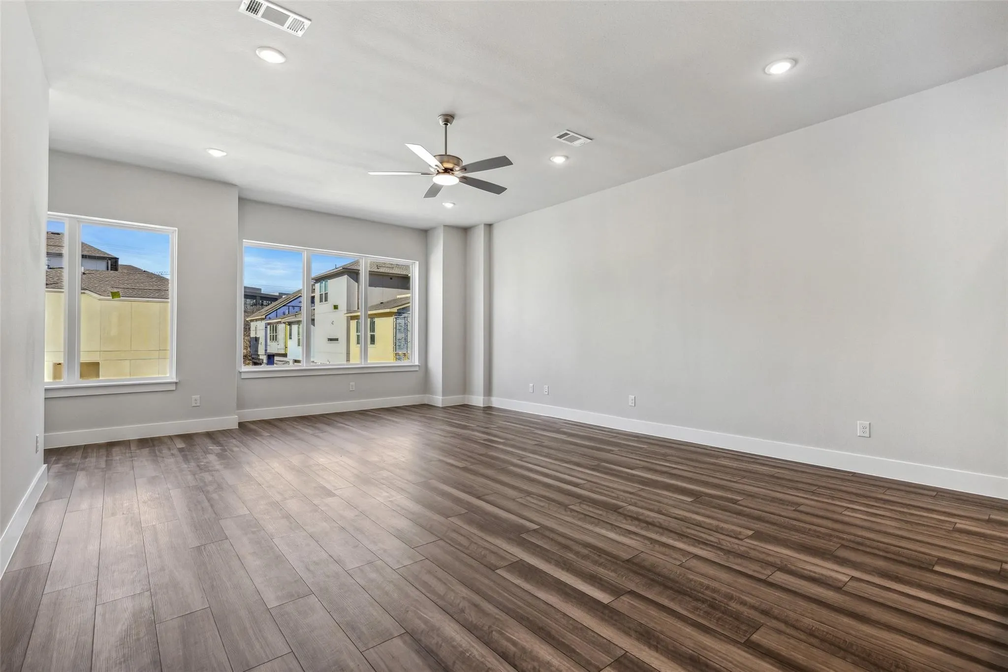 EXPANSIVE WALL OF WINDOWS IN MAIN LIVING AREA ON LEVEL TWO  FOR NATURAL LIGHT