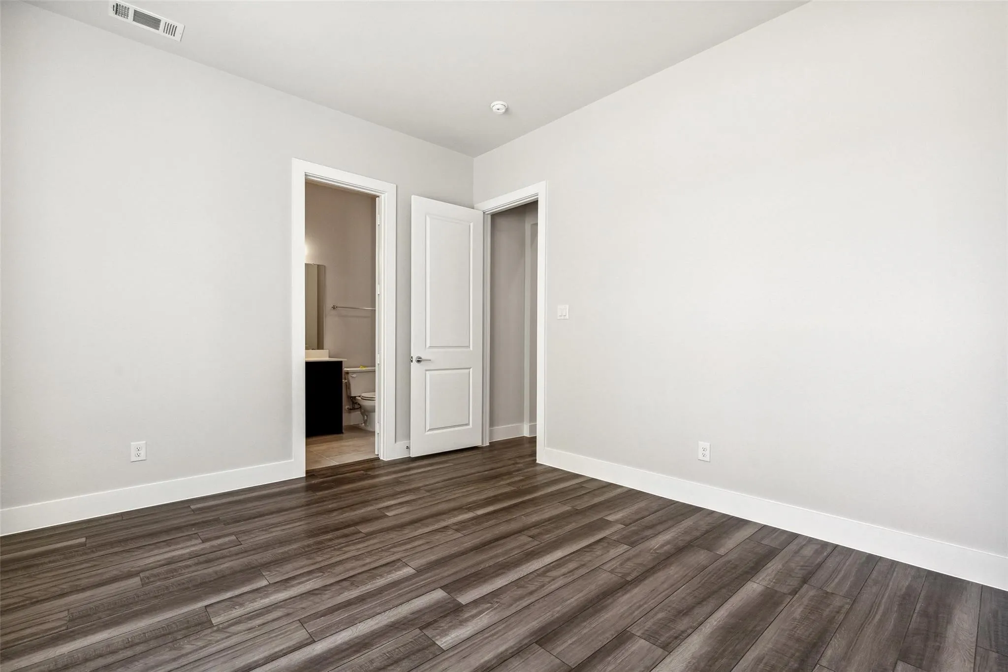 SECOND BEDROOM ON LEVEL ONE BEYOND THE KITCHEN AREA