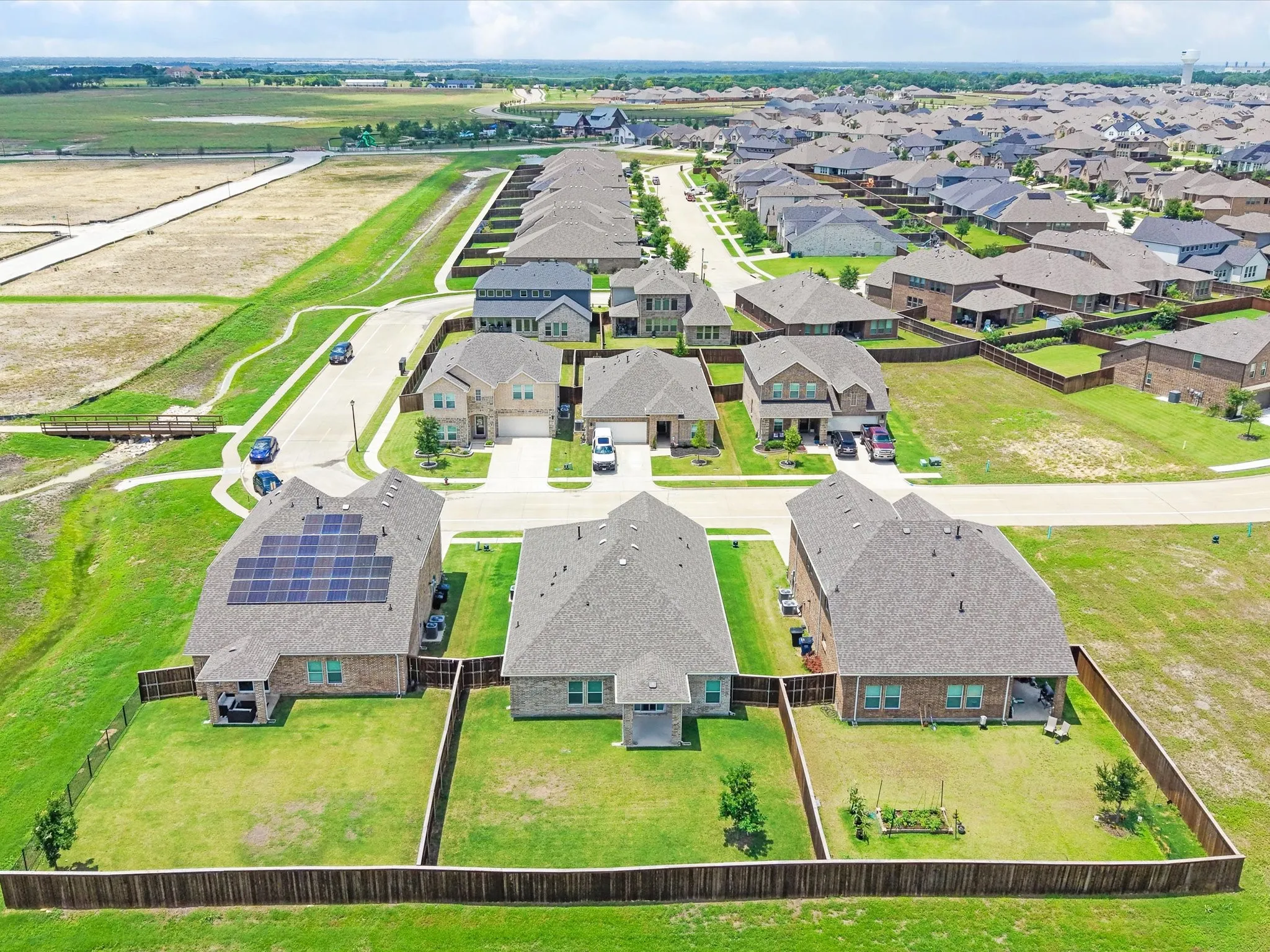 Aerial perspective showcasing a residential community with numerous single-family homes