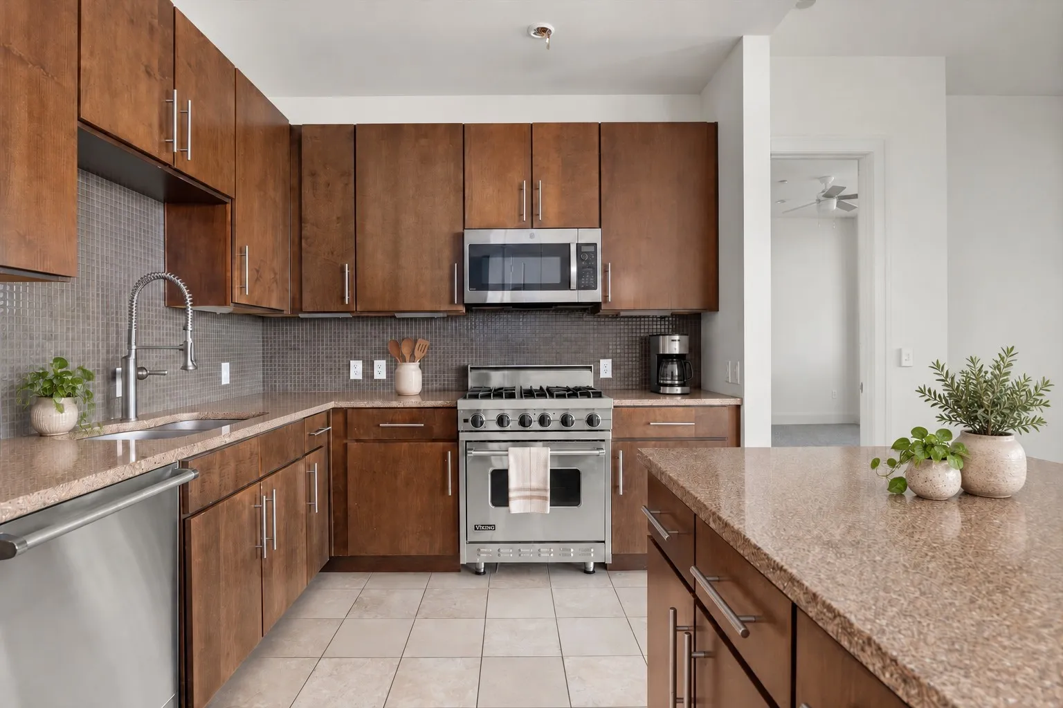 Viking appliances, island, gas range and gas oven.  Cook with veautiful views from floor to ceiling windows