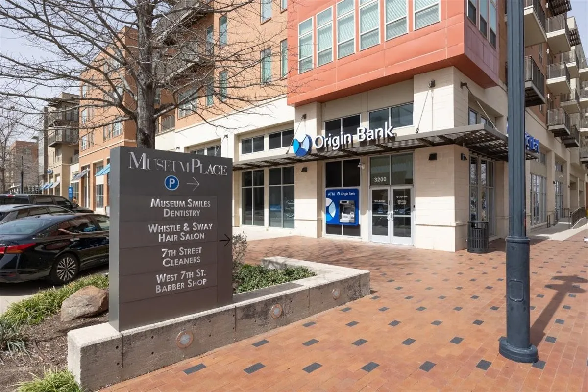 Businesses along side the entrance to One Museum Place.  Pilates studio, Restaurants, World of Beer.