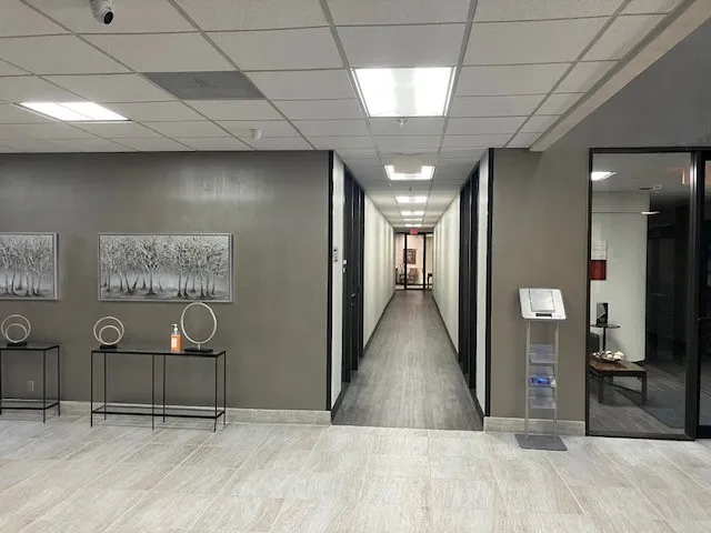 Entry area with light-toned rectangular floor tiles