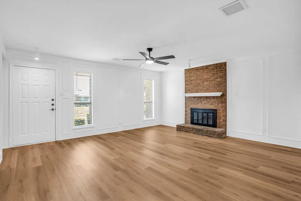 Another view of living room. Good natural light. New ceiling fan with remote.