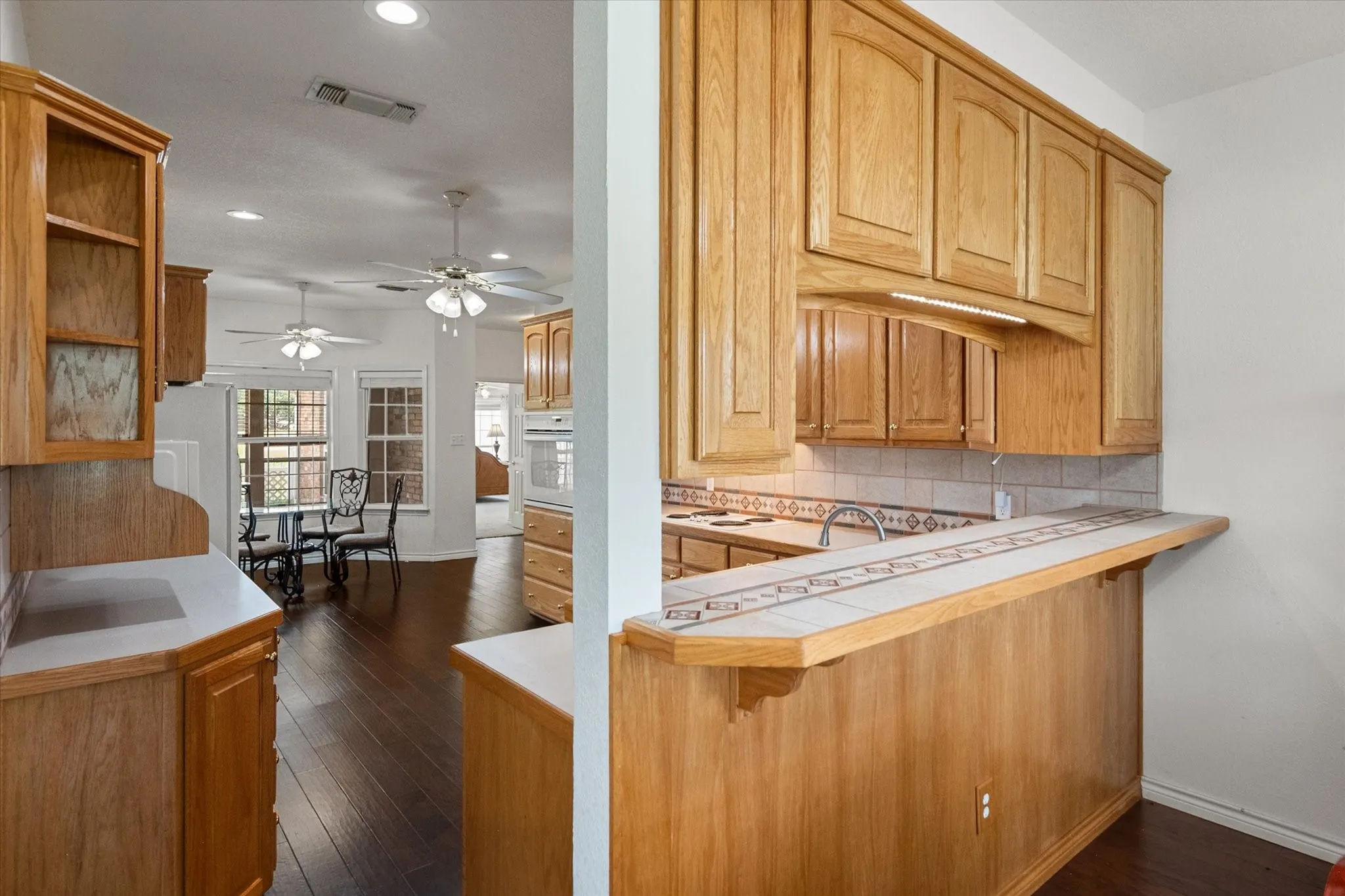 Kitchen pass-through near Corsicana adds convenience and connection between the dining area and spacious kitchen.