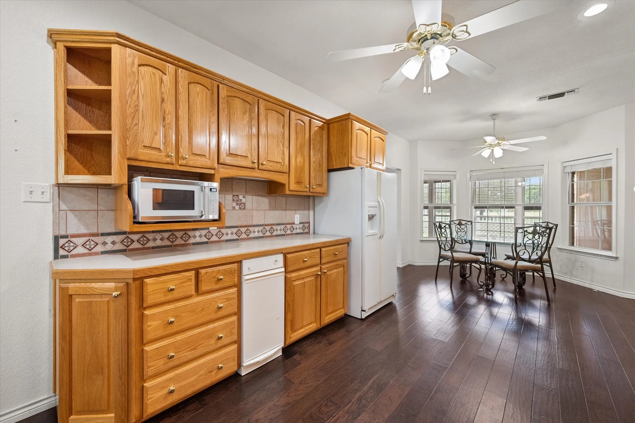 Roomy kitchen near Dallas featuring abundant cabinetry, built-in appliances, and great storage for full-time or weekend living.