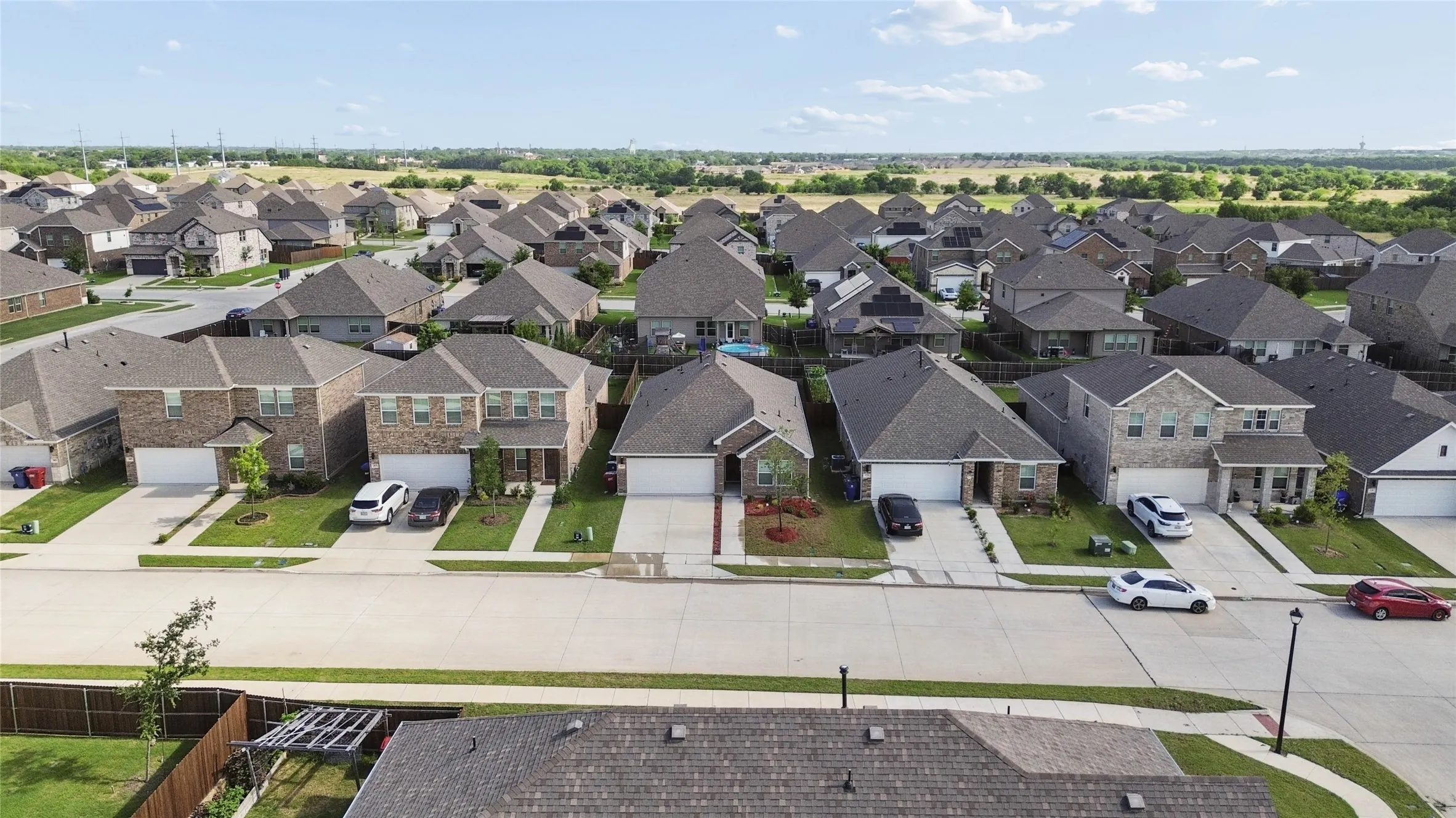 Aerial perspective showcasing a residential street with multiple single-family homes