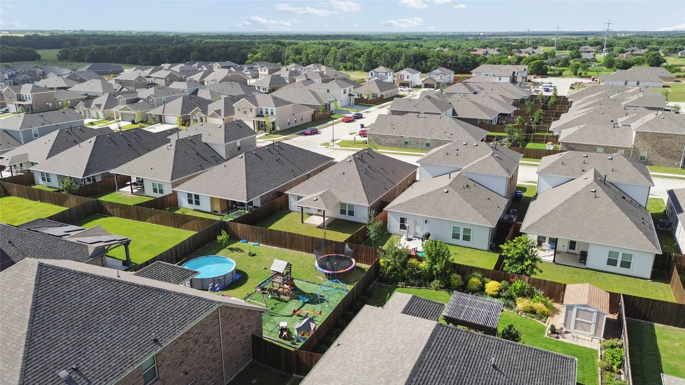 Neighborhood of single-family residences with fenced backyards