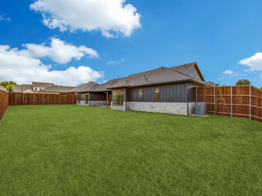 Expansive lawn with a full privacy fence
