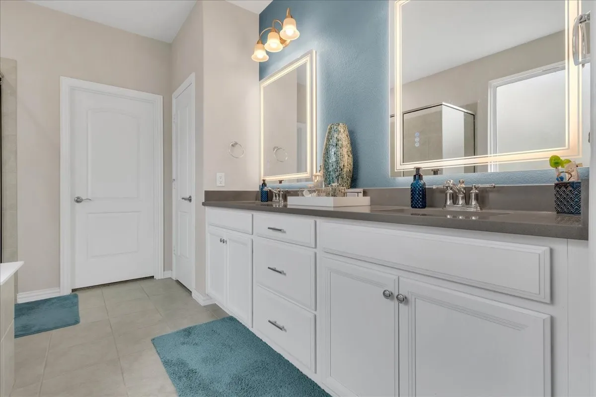 Dual vanity with integrated sinks and gray countertops