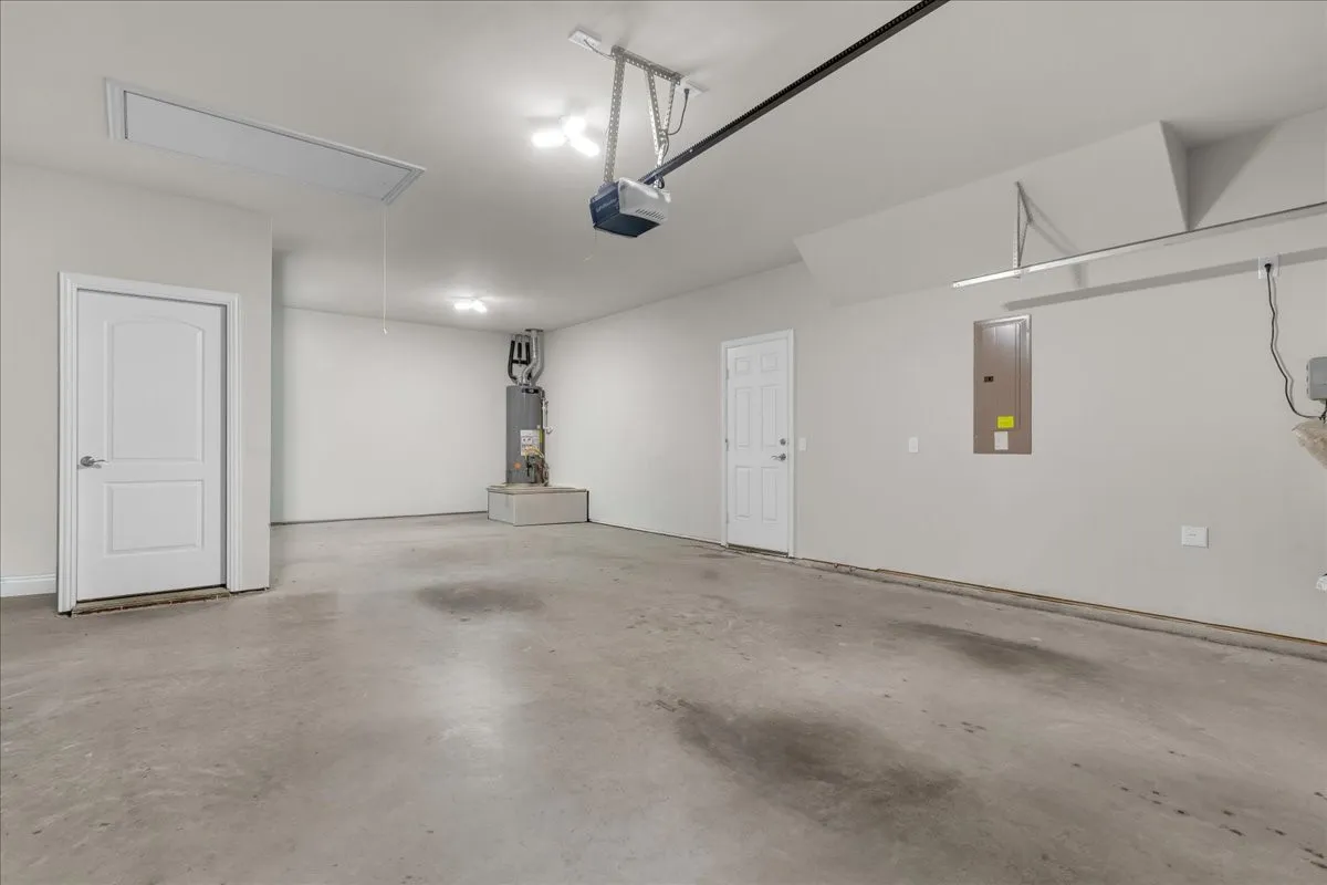 Spacious two-car garage with concrete flooring
