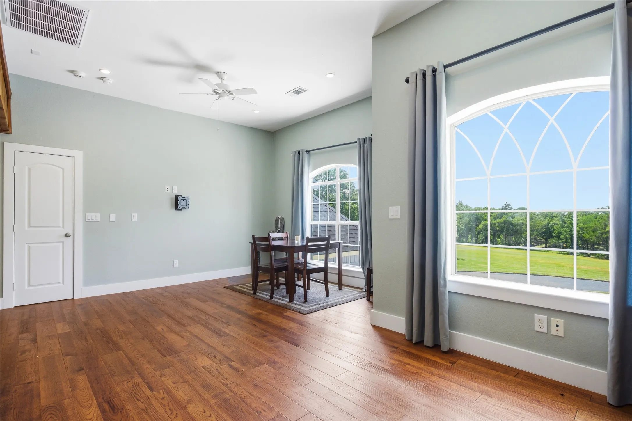 The view from the loft provides a gorgeous look at the landscape at the front of the house.