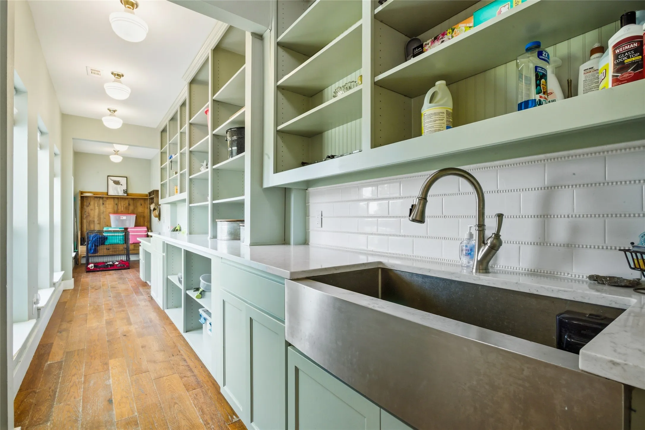A huge Butler's Pantry will amaze you!  Equipped with a large stainless farm sink and all the cabinets and storage you can imagine, it's love at first site.  At the end of this room, a mudroom provides space for shoes and coats when coming in from the garage.