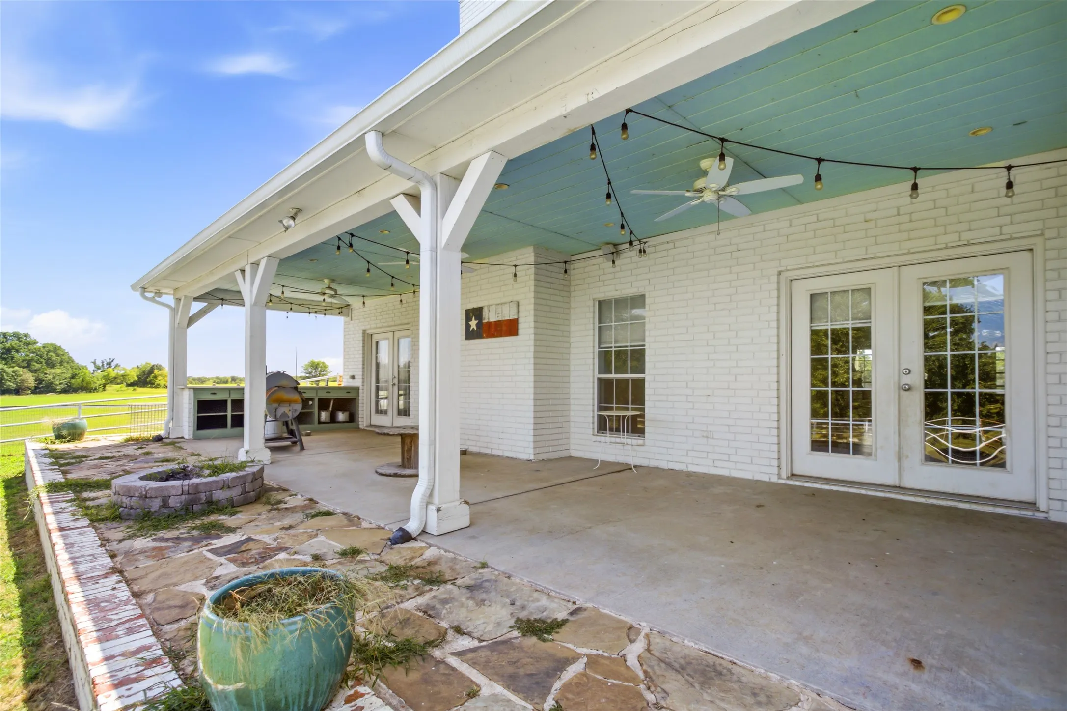 Large back porch with cabinet area.