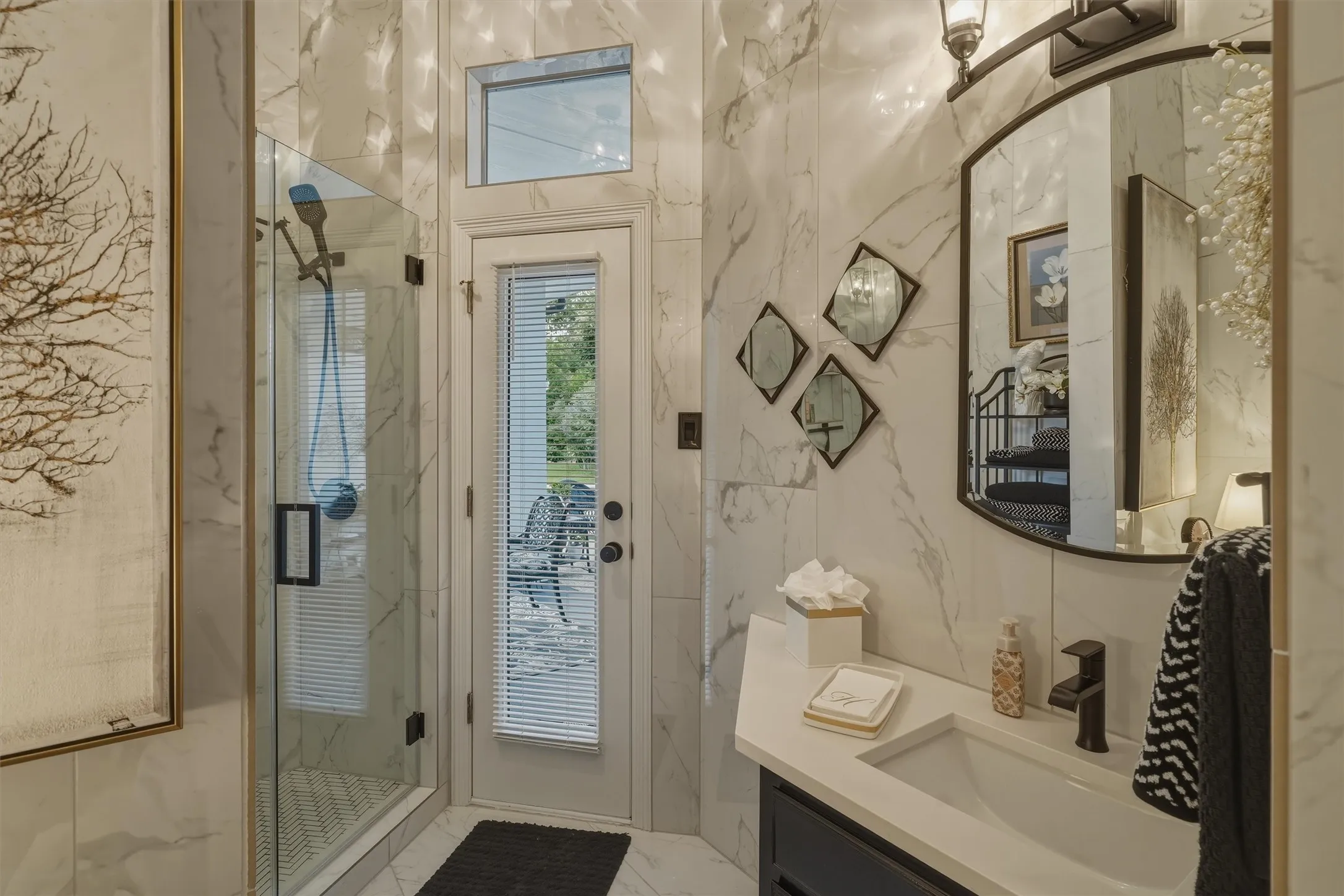 Updated bathroom with direct access to outdoor pool.
