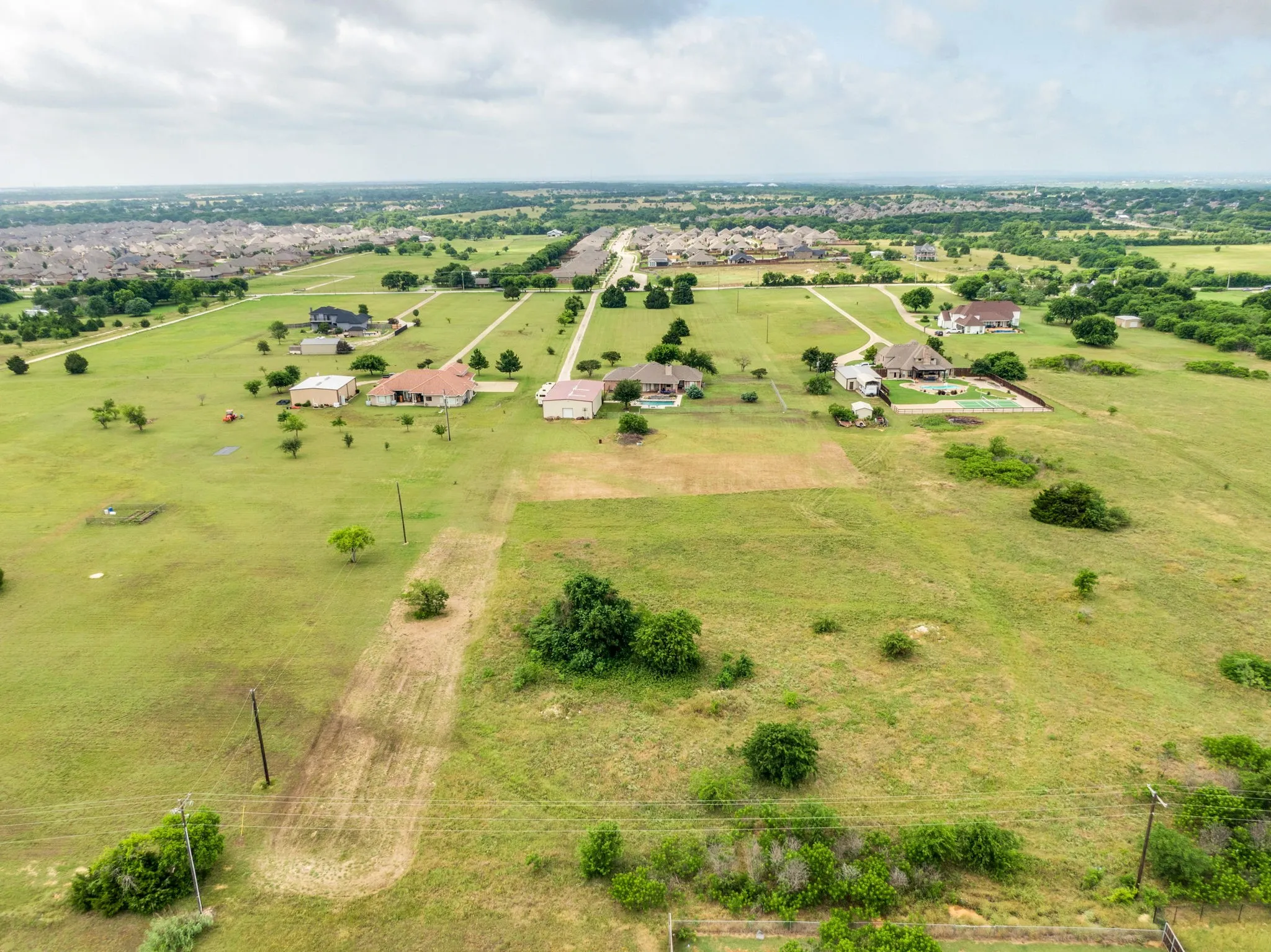 Expansive open acreage with scattered trees