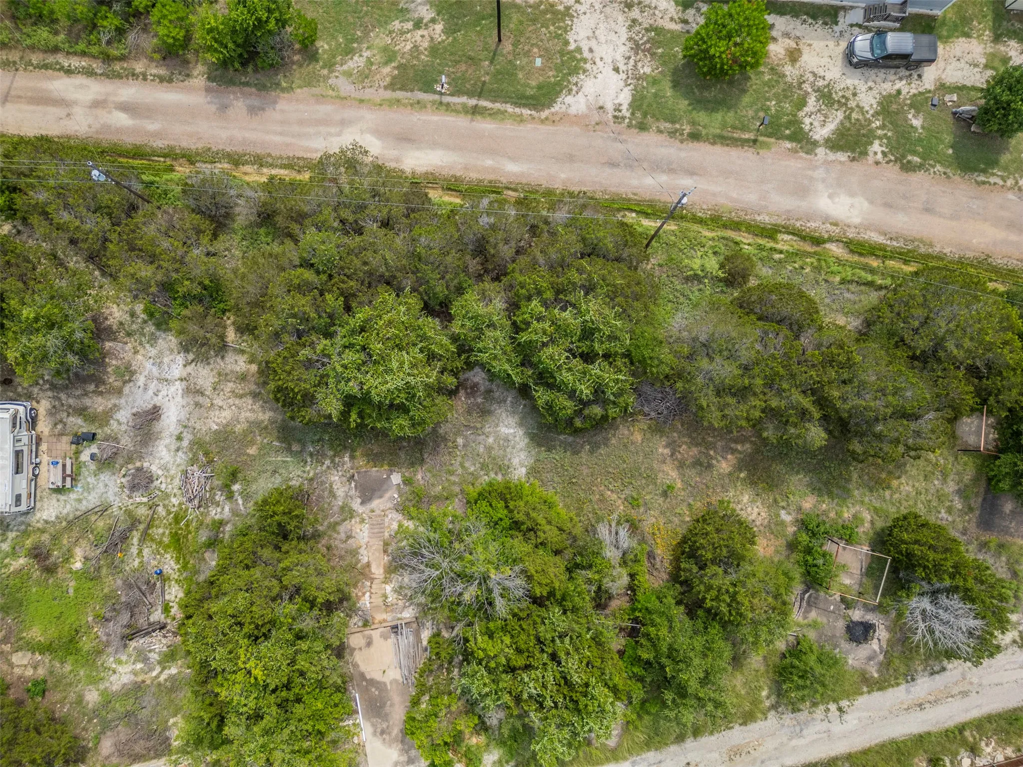 Expansive undeveloped land featuring mature trees and a natural landscape