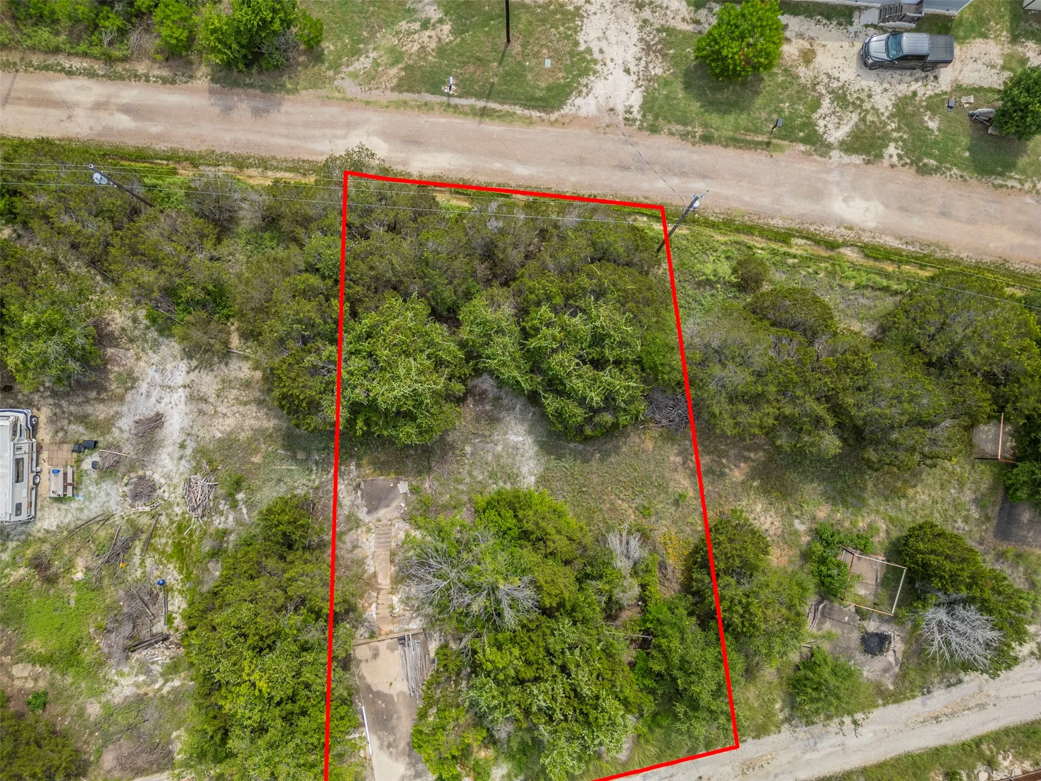 Expansive undeveloped lot featuring mature trees and varied foliage