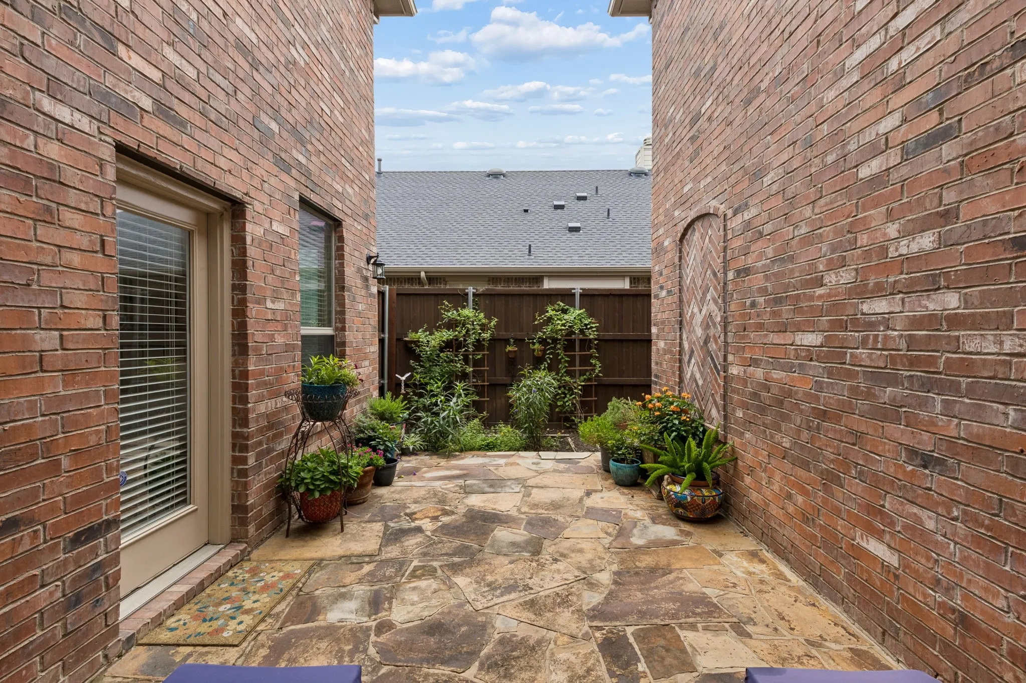 Private stone patio featuring flagstone paving
