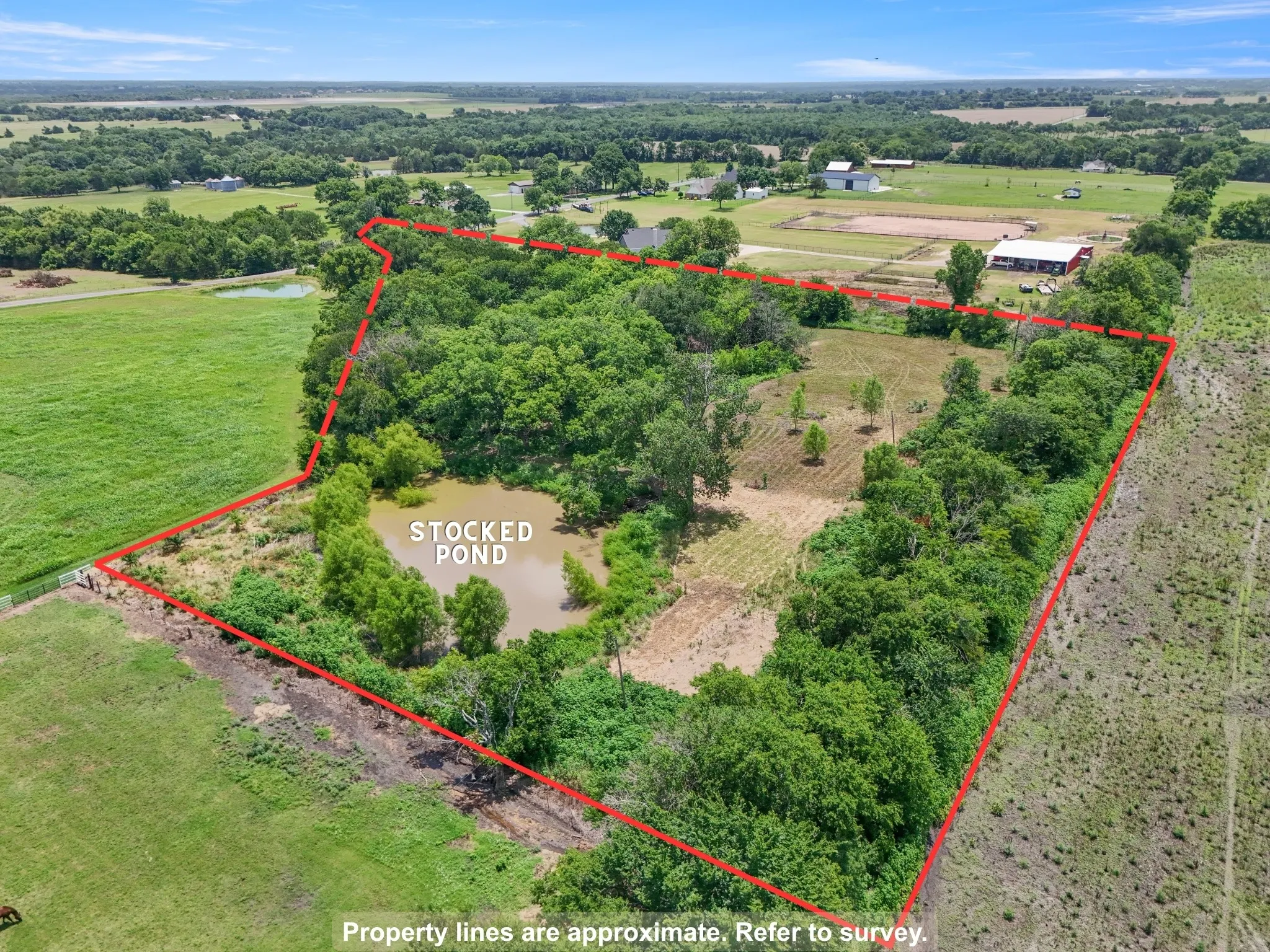 Property overview featuring the stocked pond, mature tree coverage, and approximate boundary lines.