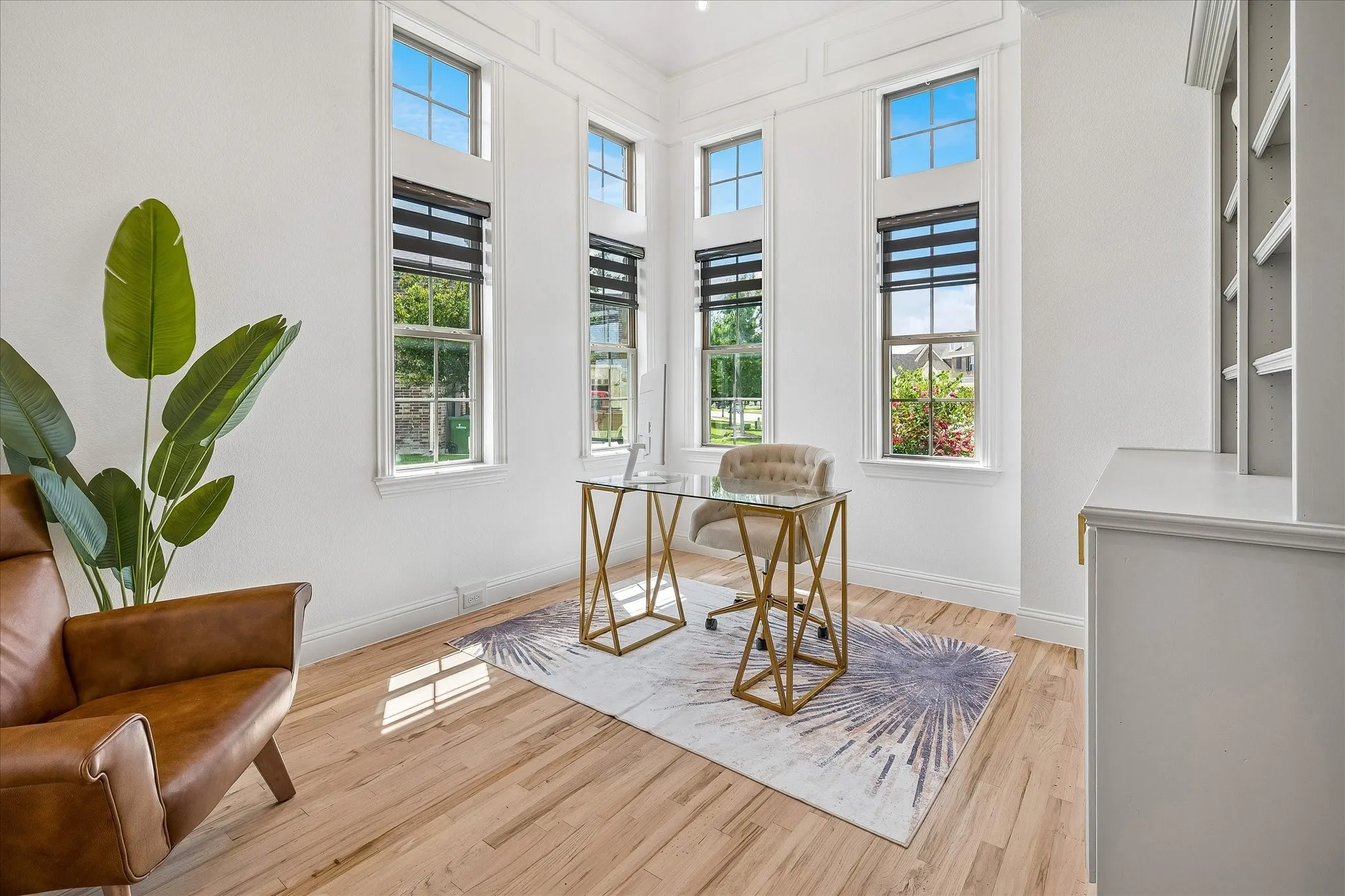 Study with tall ceilings, built-ins and iron door with glass