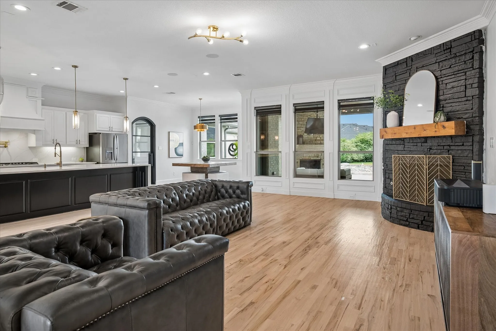 Open Living Room to Kitchen overlooks Beautiful Backyard