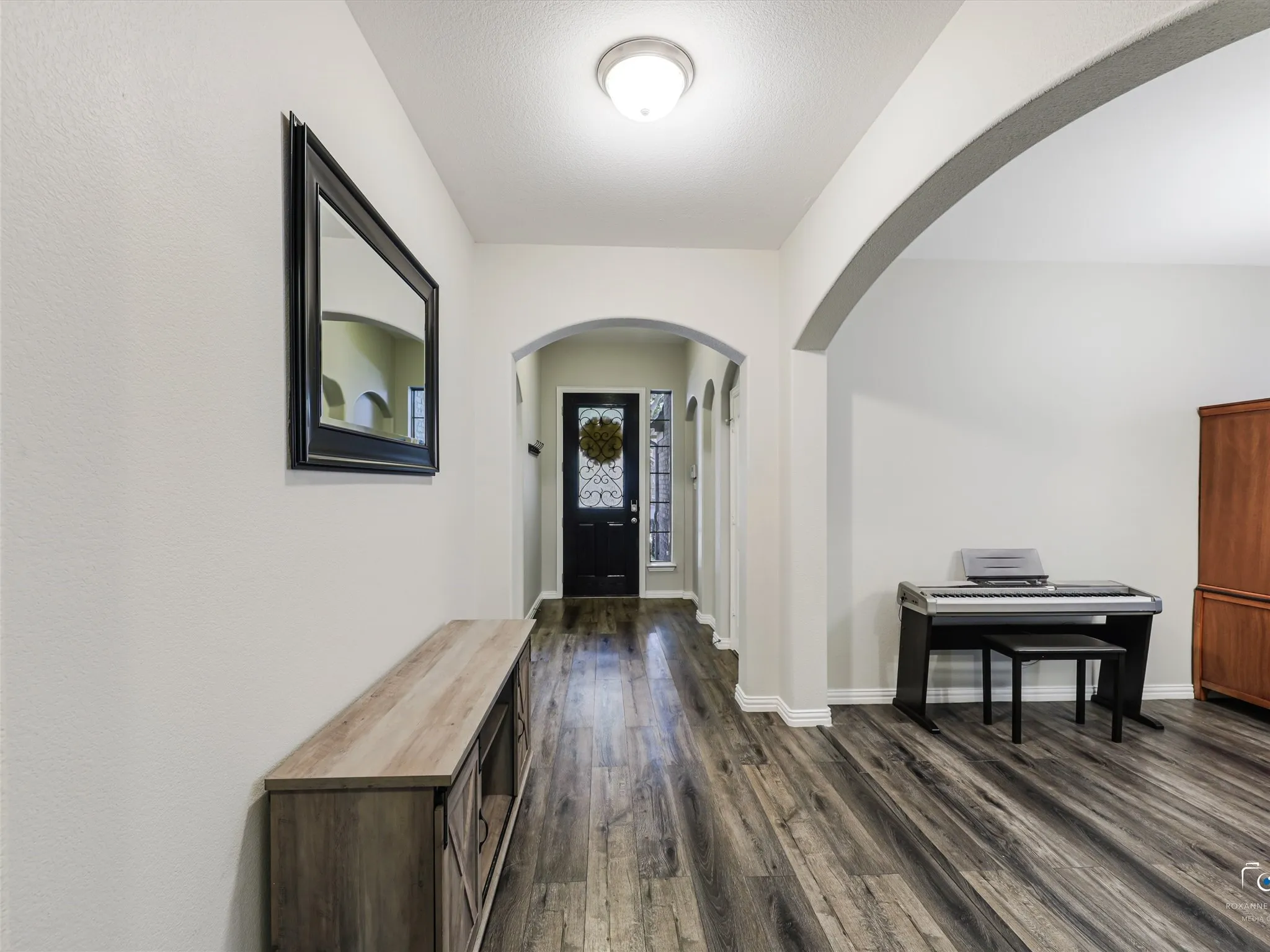 entryway leading to formal dining room currently set as a playroom.