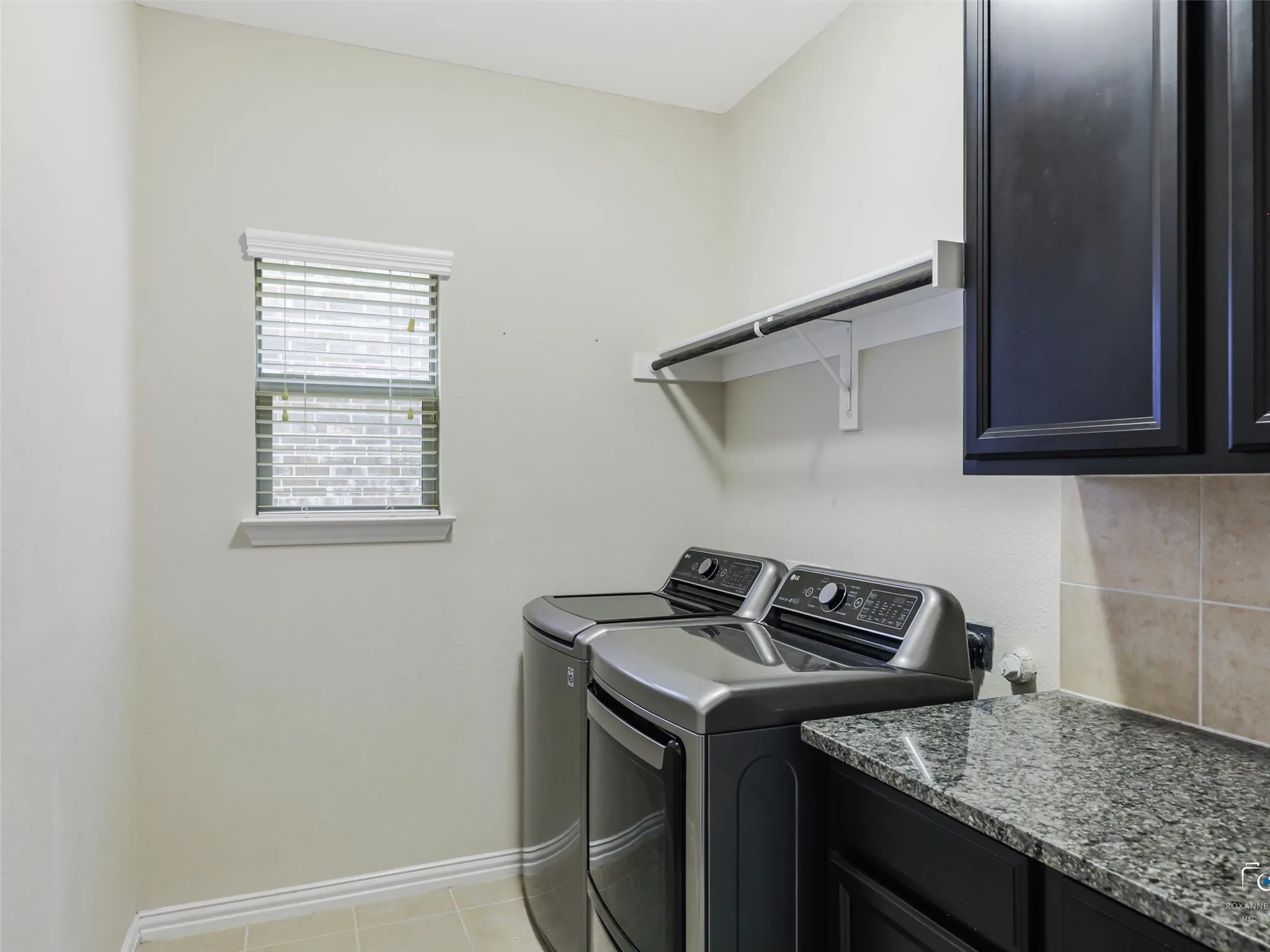 Laundry room located on ground floor near the kitchen.