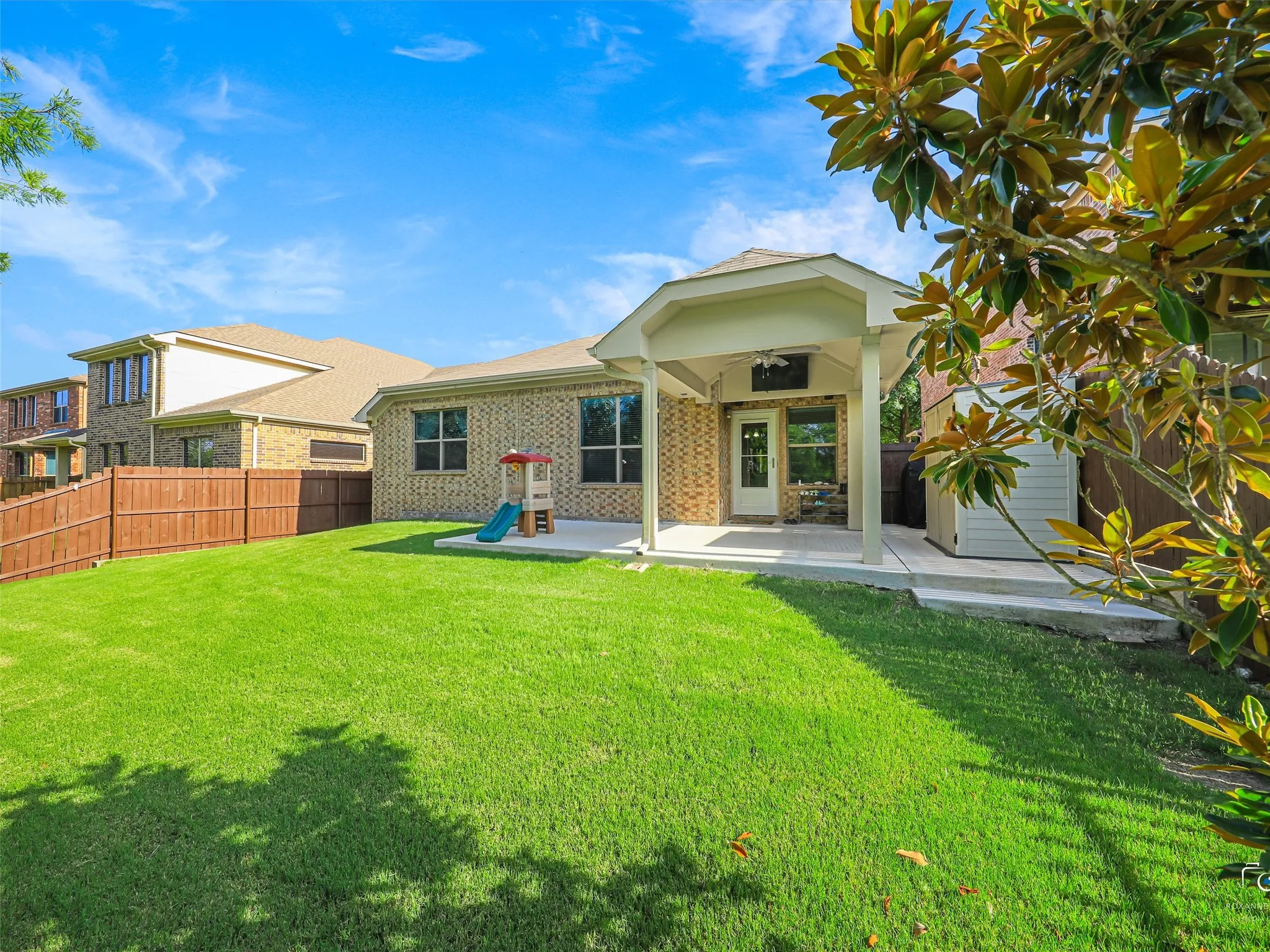 Large back yard with coverd patio and electrical for TV.