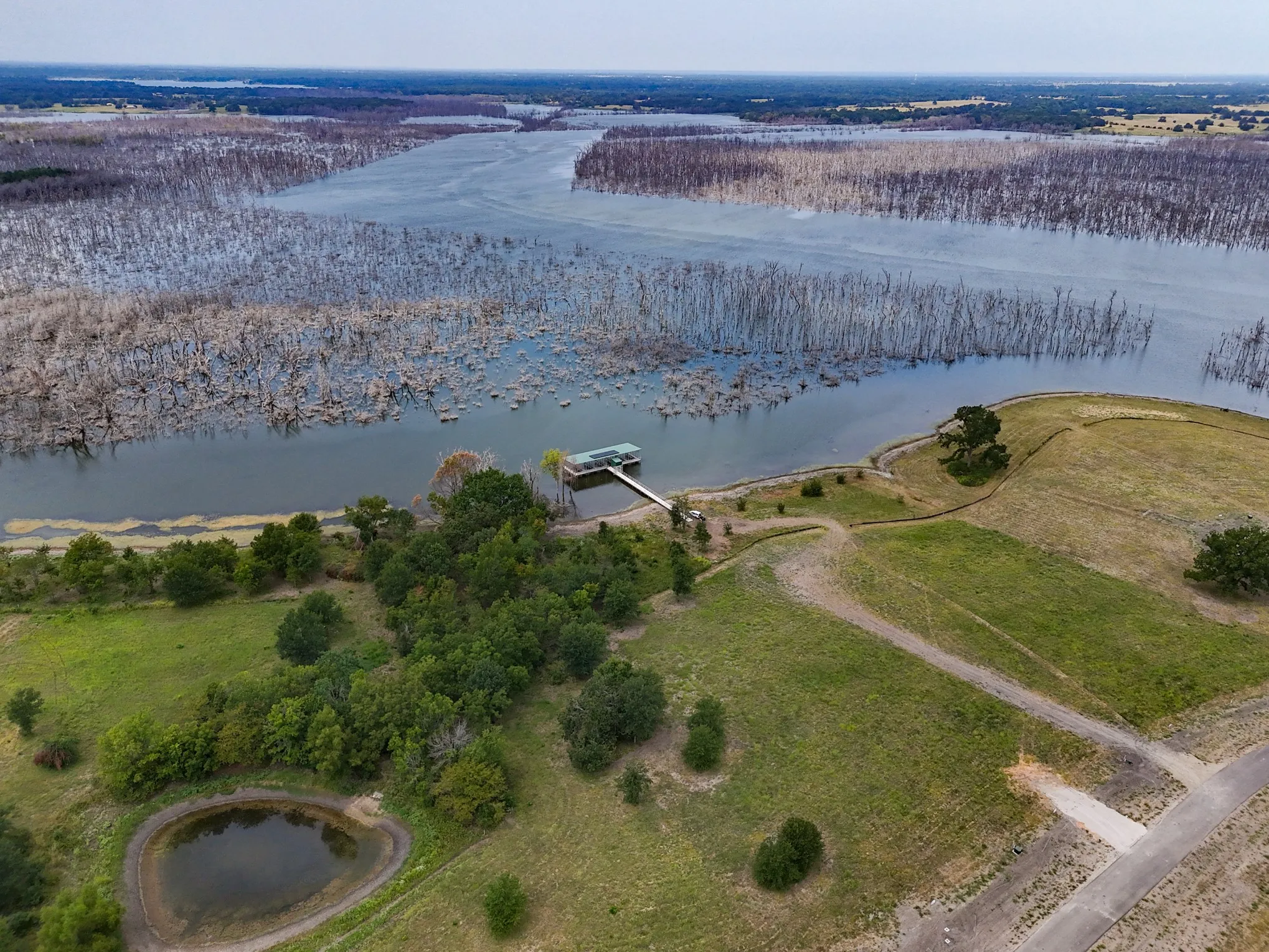 Aerial overview of property's location featuring a large body of water