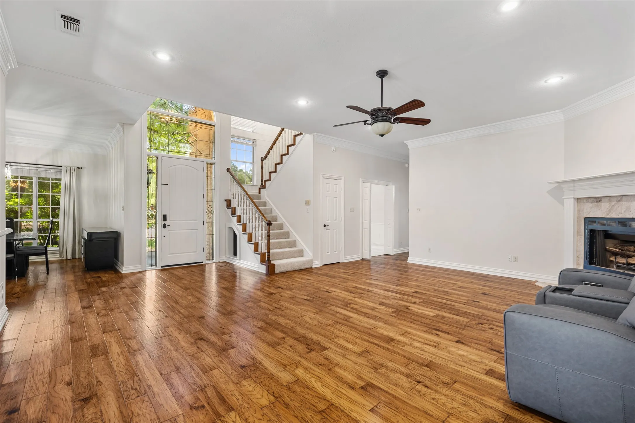 Open concept living with spacious room and luxurious hand-scraped hardwood floors.