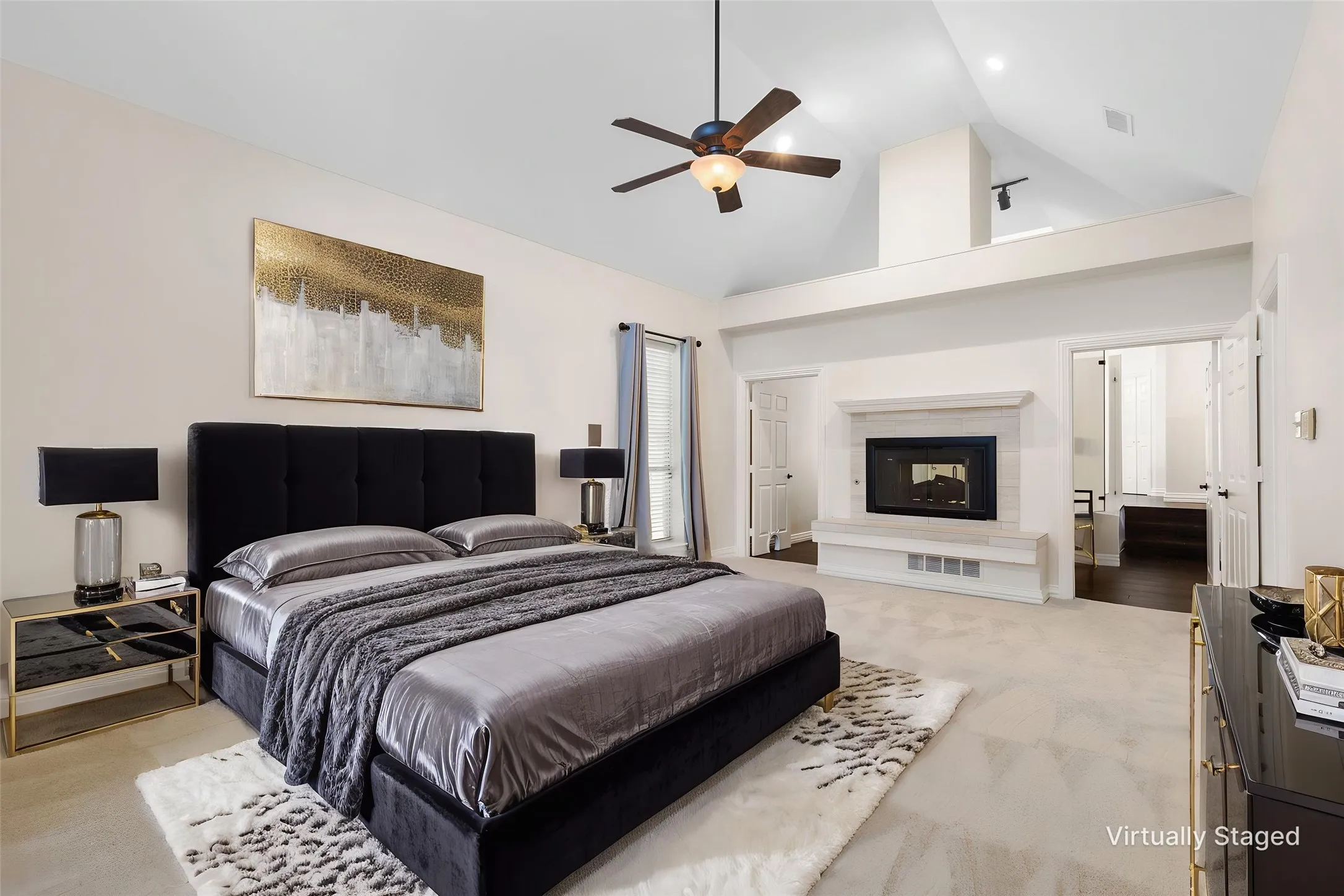 Oversized Primary Suite downstairs with carpet, high ceilings, fireplace and en-suite bath.  Virtually Staged.