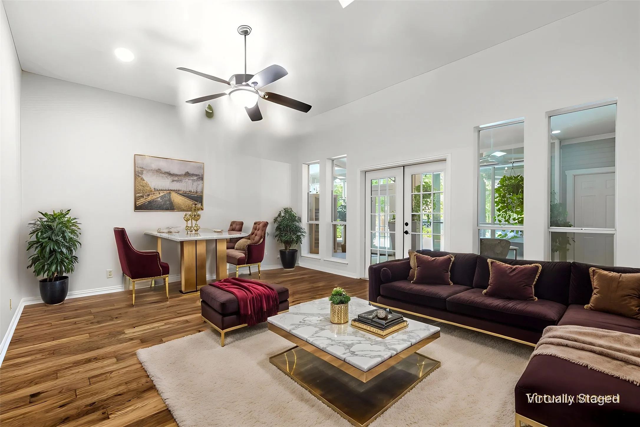 Living Room facing Sunroom and backyard with hardwood floors & high ceilings.  Virtually Staged.