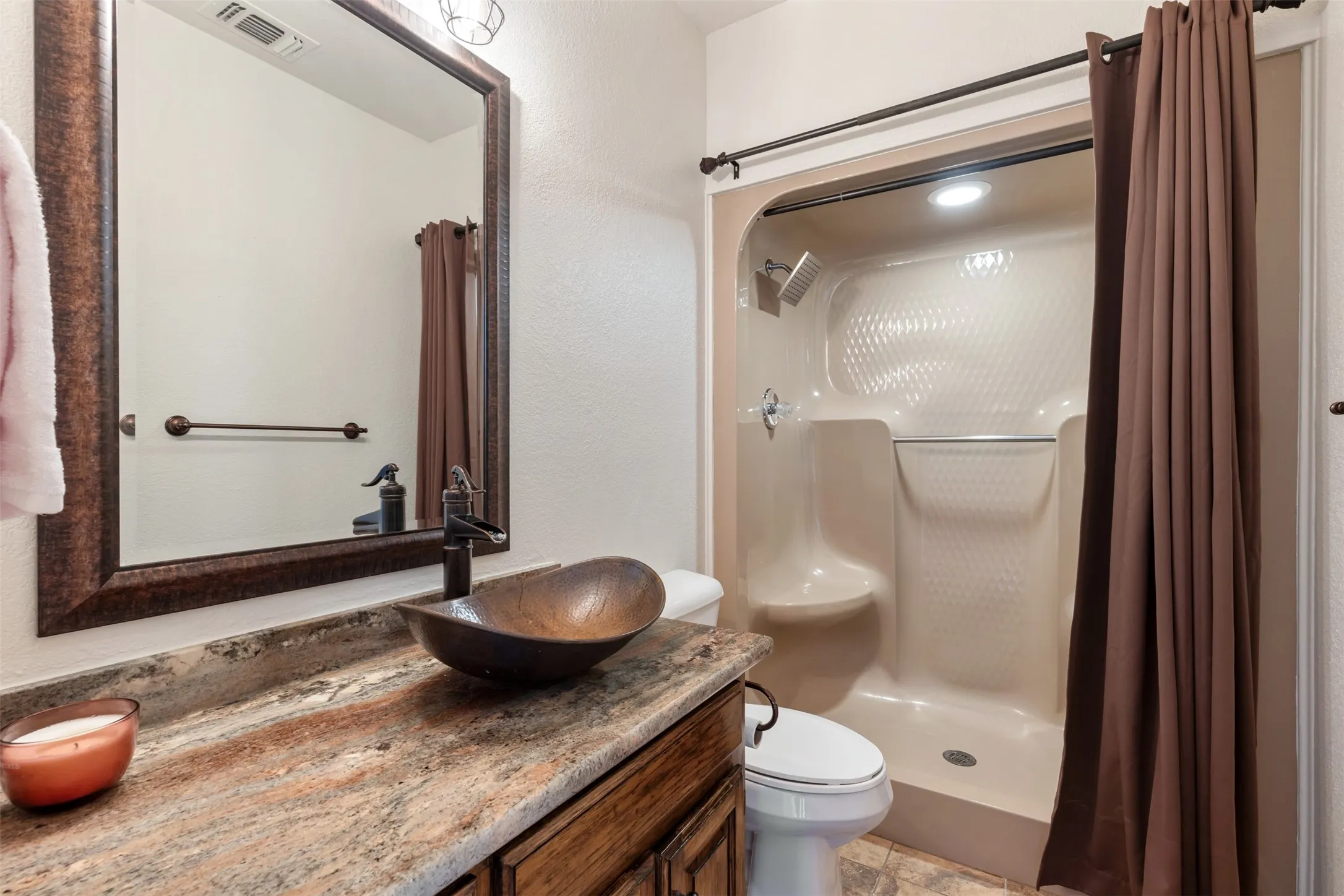 First floor full bath near garage entry. Convenient for pool guests.