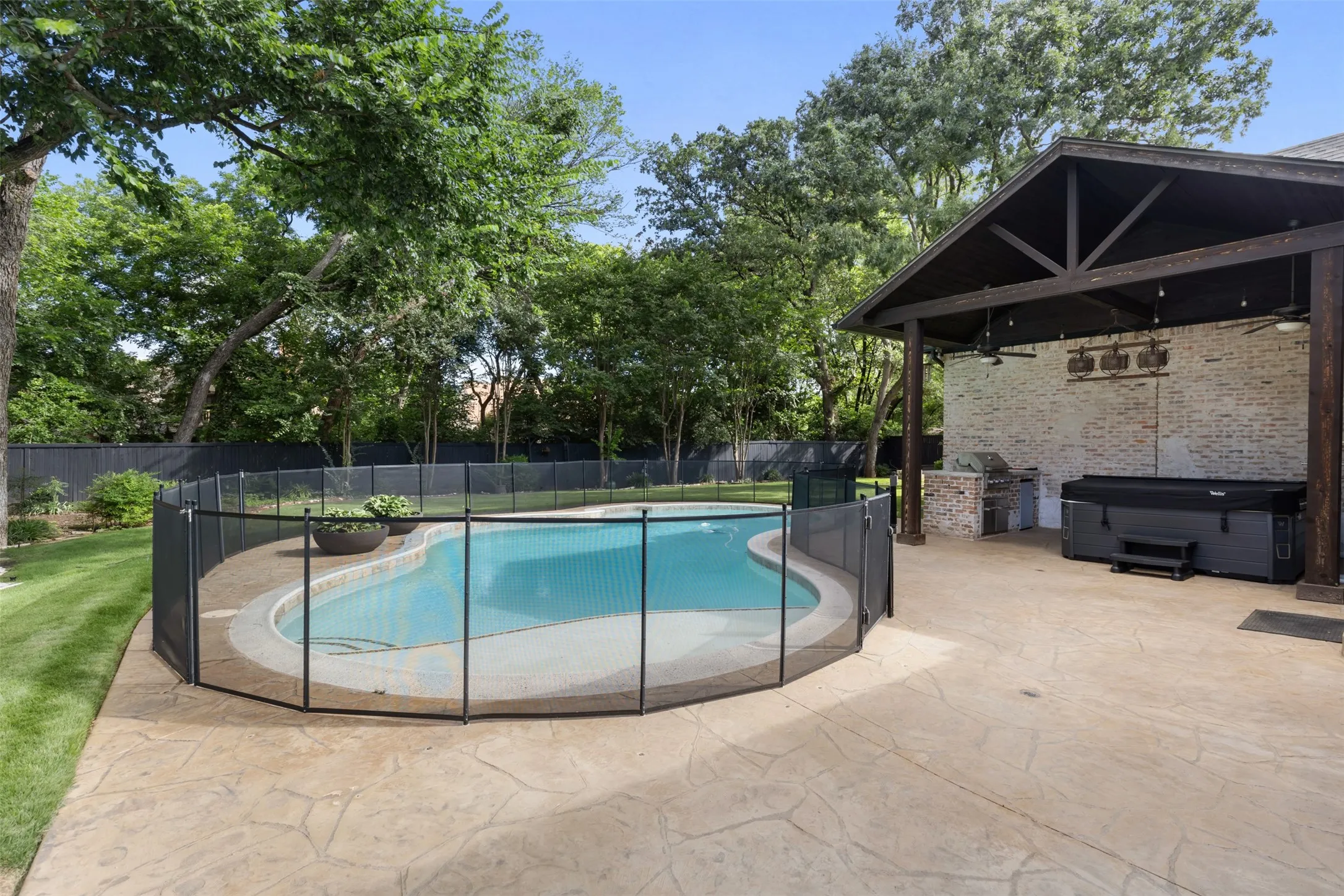 In-Ground Gunite pool with removable fence (shown), cover (not shown) - approx 5.5ft deep, 20k gallons.