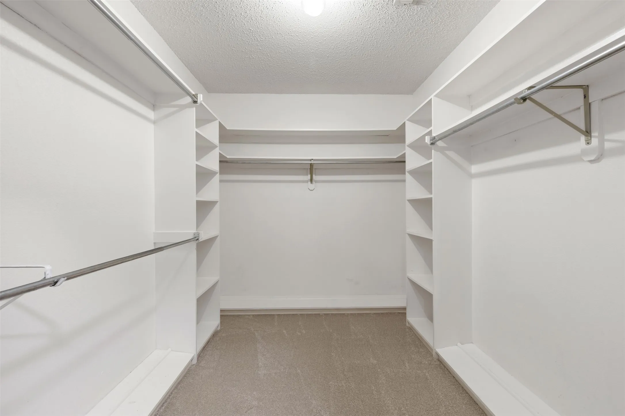 Primary walk-in closet.  There are 2.