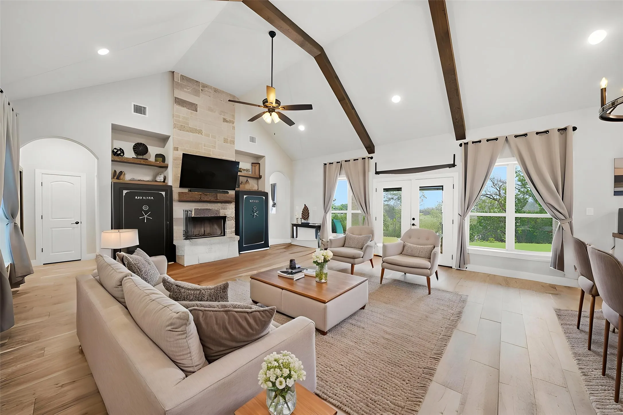 HUGE Open and light living and dining area with custom vaulted ceilings! AI Staged for visual purposes.