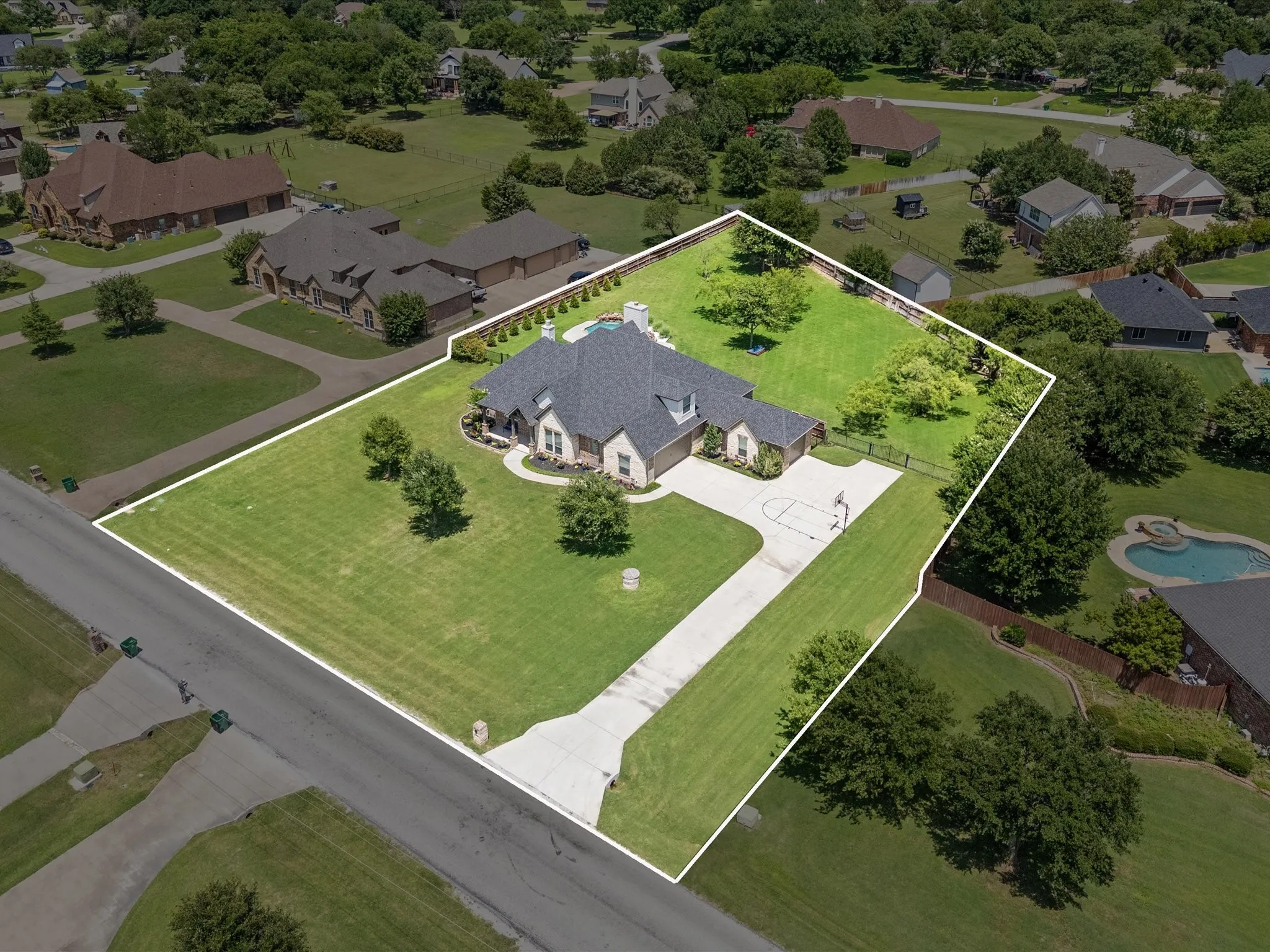 Beautifully updated custom home situated on a one-acre lot in Aurora Vista with mature landscaping, stone accents, and exceptional curb appeal.