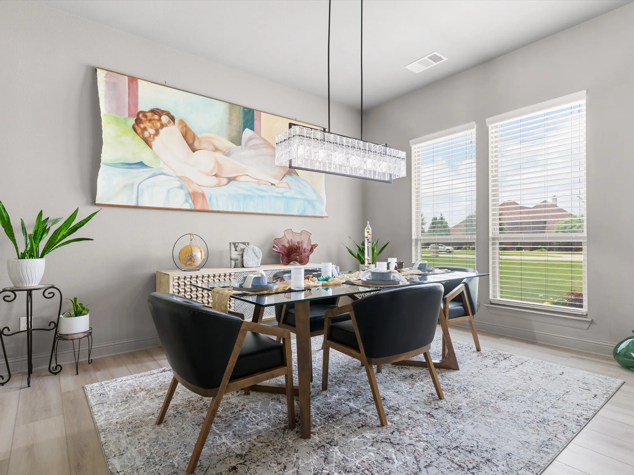 Formal dining space with updated lighting and easy access to the kitchen and living areas.