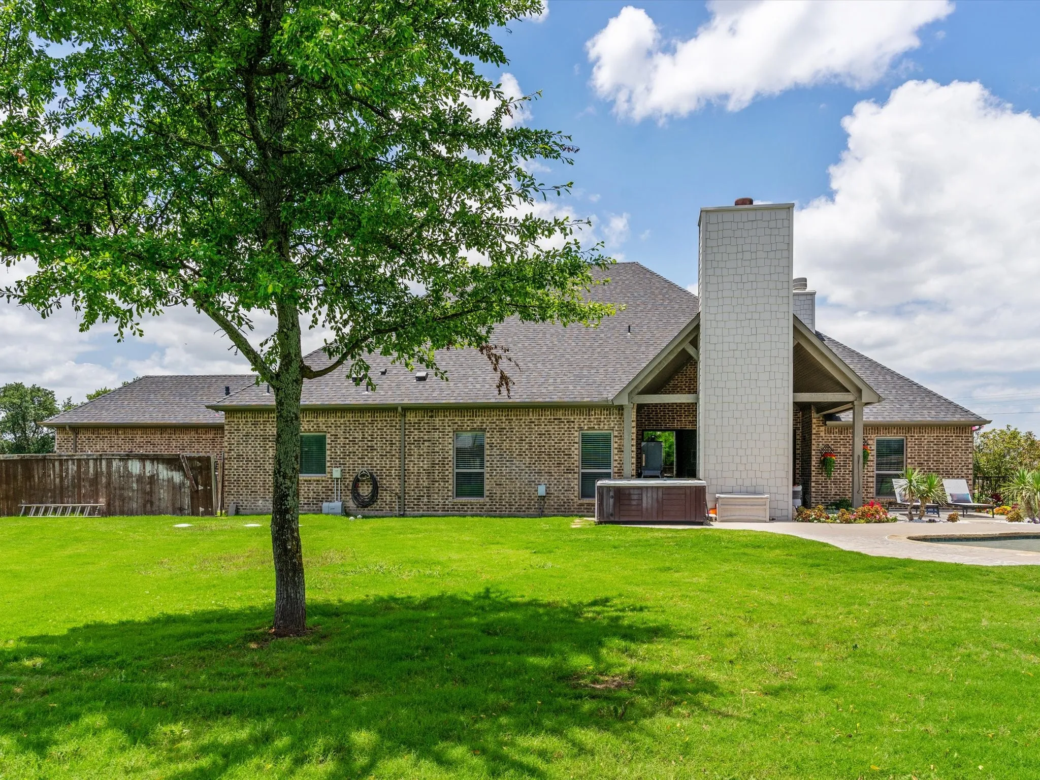 Beautifully updated custom home situated on a one-acre lot in Aurora Vista with mature landscaping, stone accents, and exceptional curb appeal.