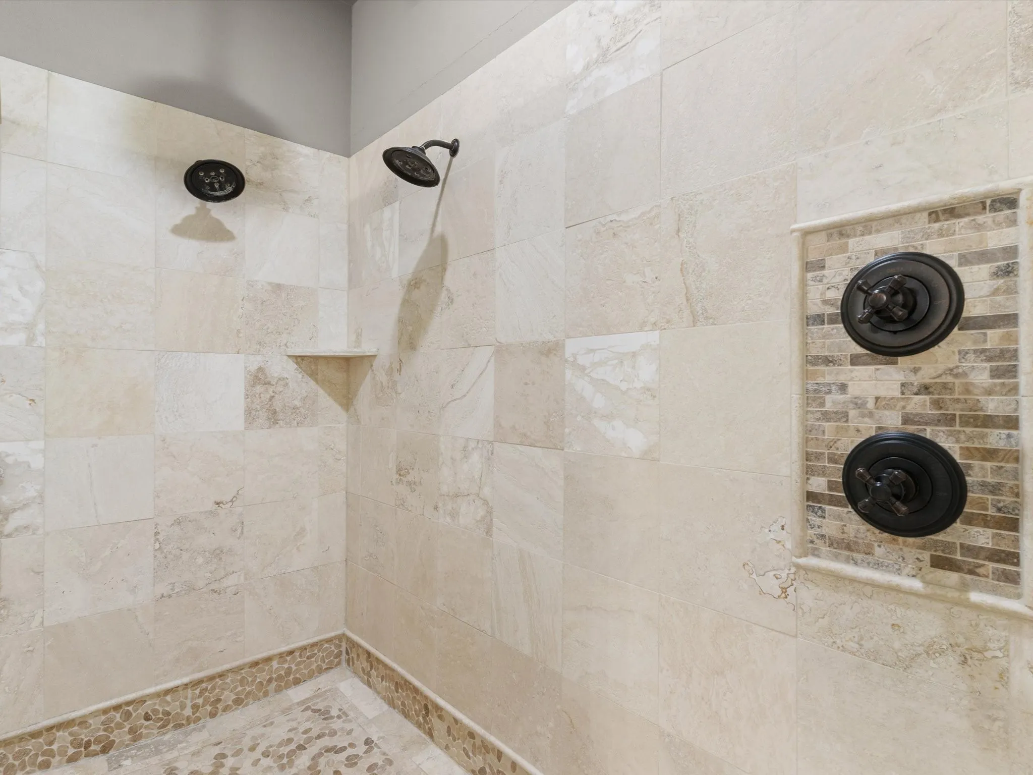Well-appointed primary bath with dual vanities, soaking tub, and separate shower.