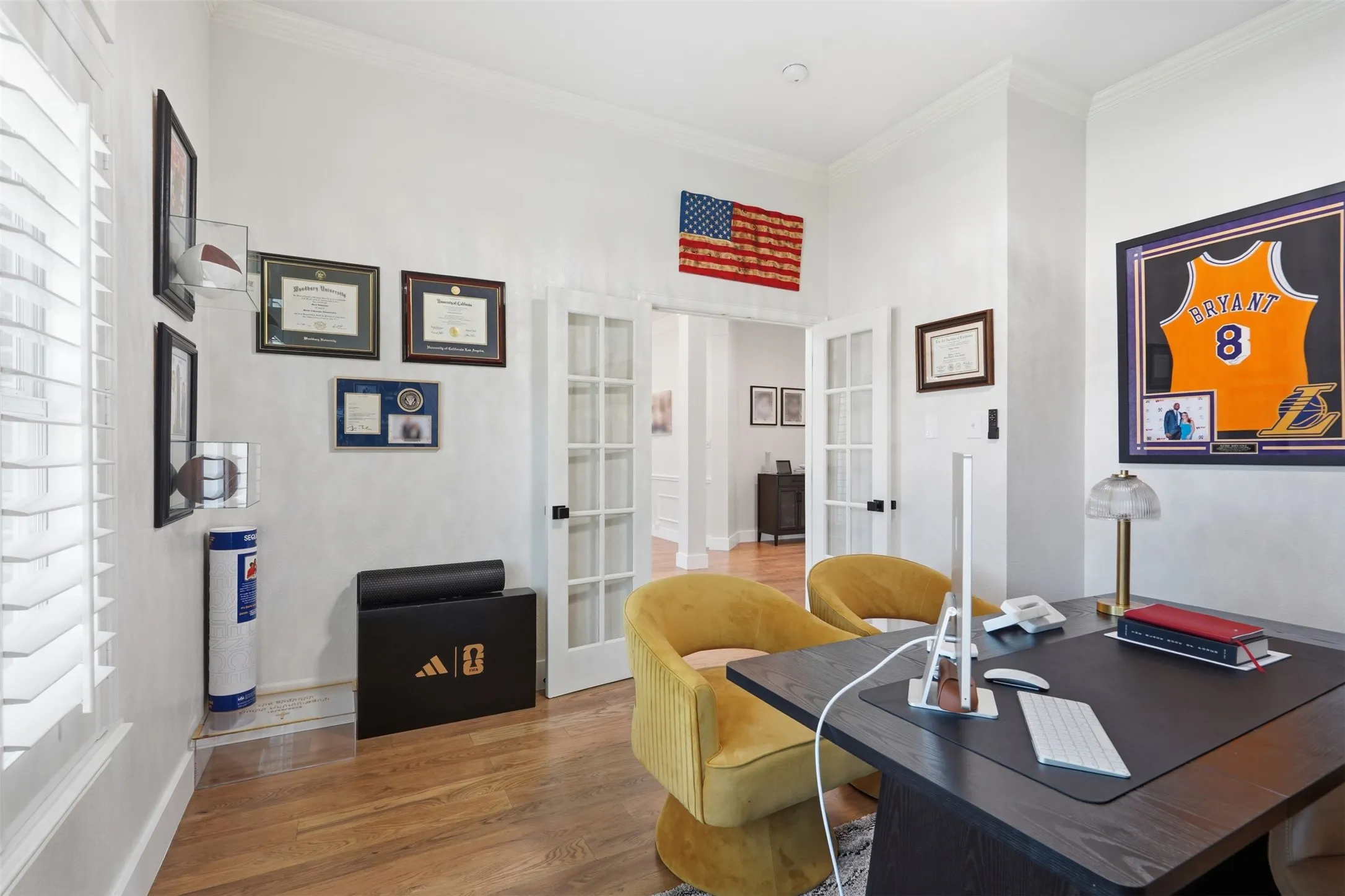 Hardwood flooring, crown molding, French doors, plantation shutters, and recessed lighting