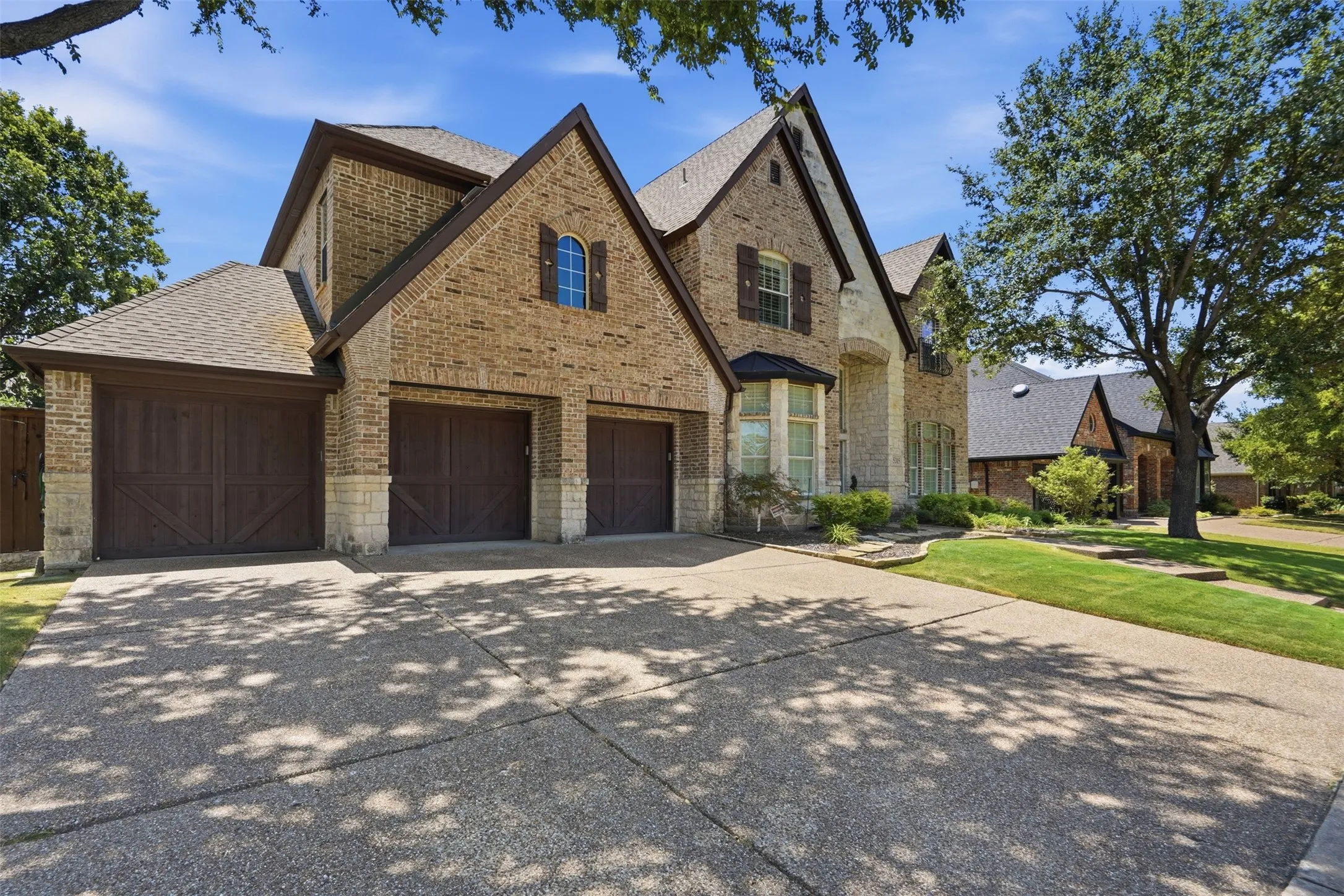 Brick and stone exterior with gabled roof lines