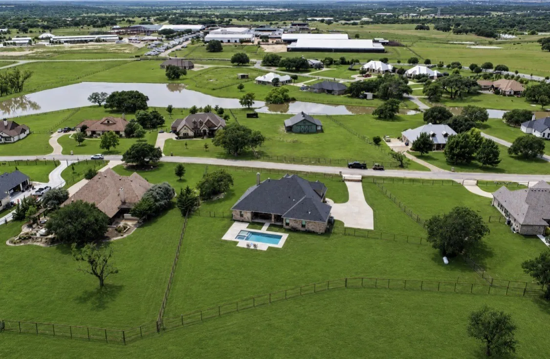 Drone image of property with AI enhanced grass.