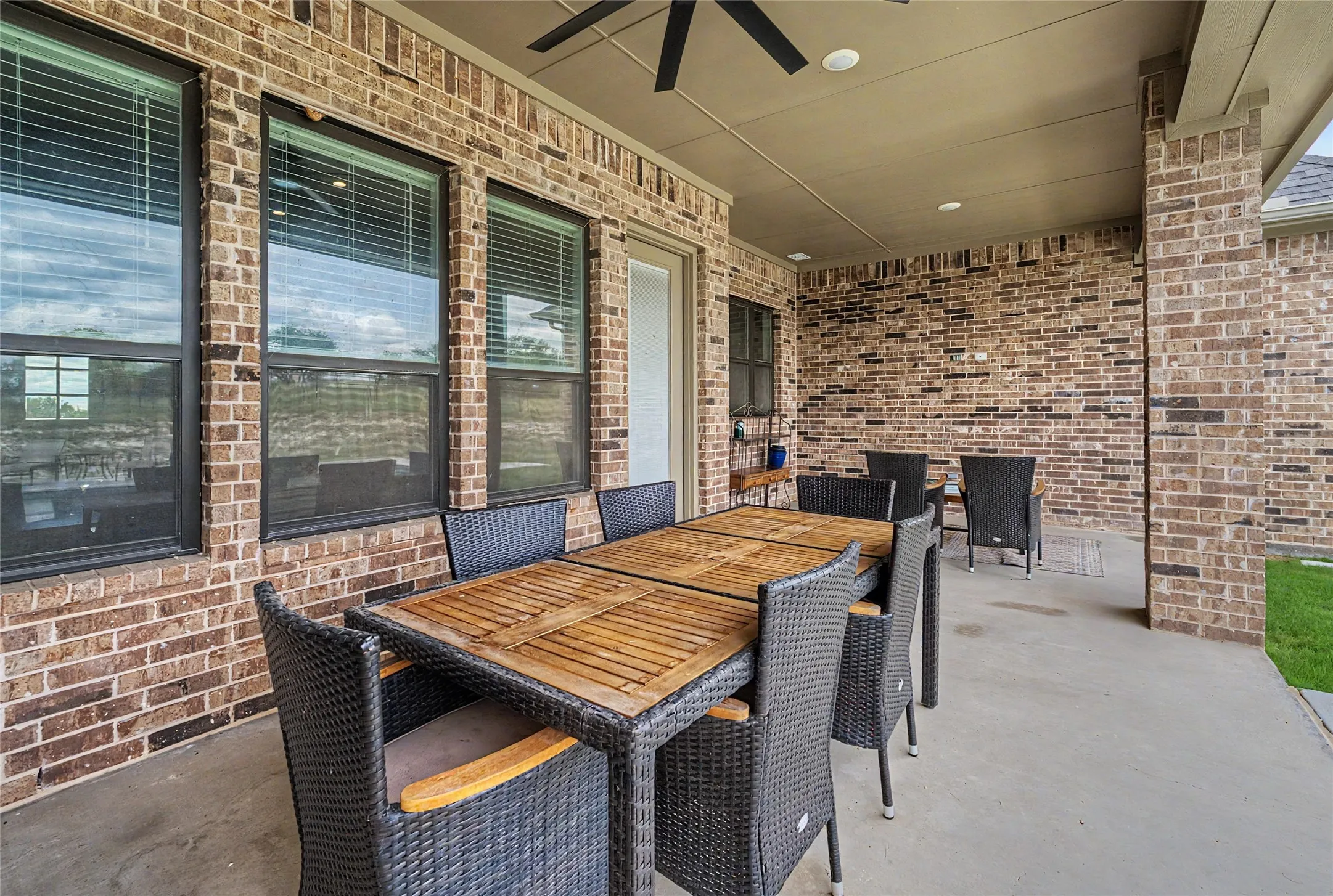 Covered outdoor patio with a concrete surface