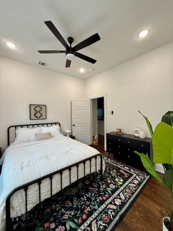 Bedroom featuring a five-panel interior door, recessed lighting, and a contemporary ceiling fan