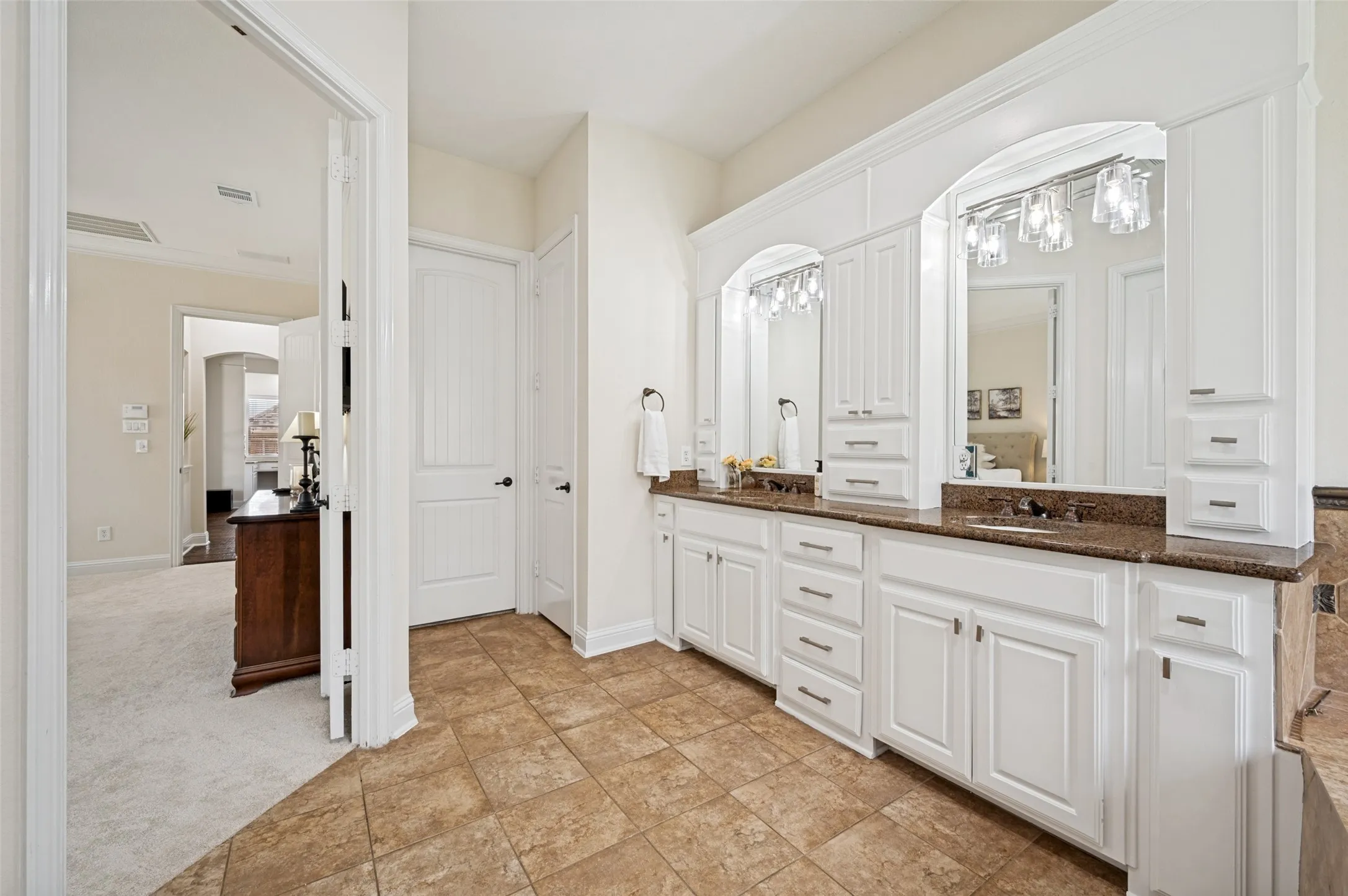 Spa like bath with dual sinks, freshly painted with new fixtures and plenty of storage.