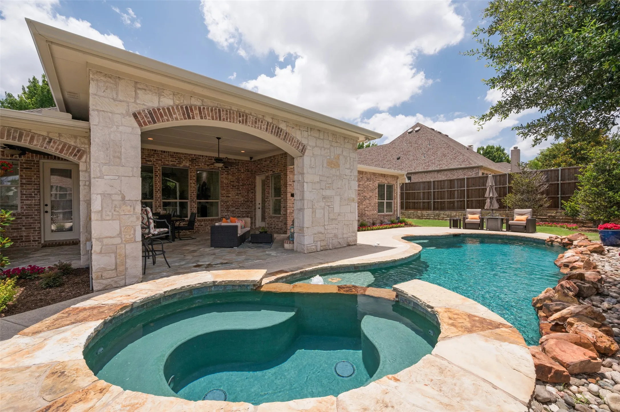 Step outside to your own private backyard oasis with a sparkling pool and spa.