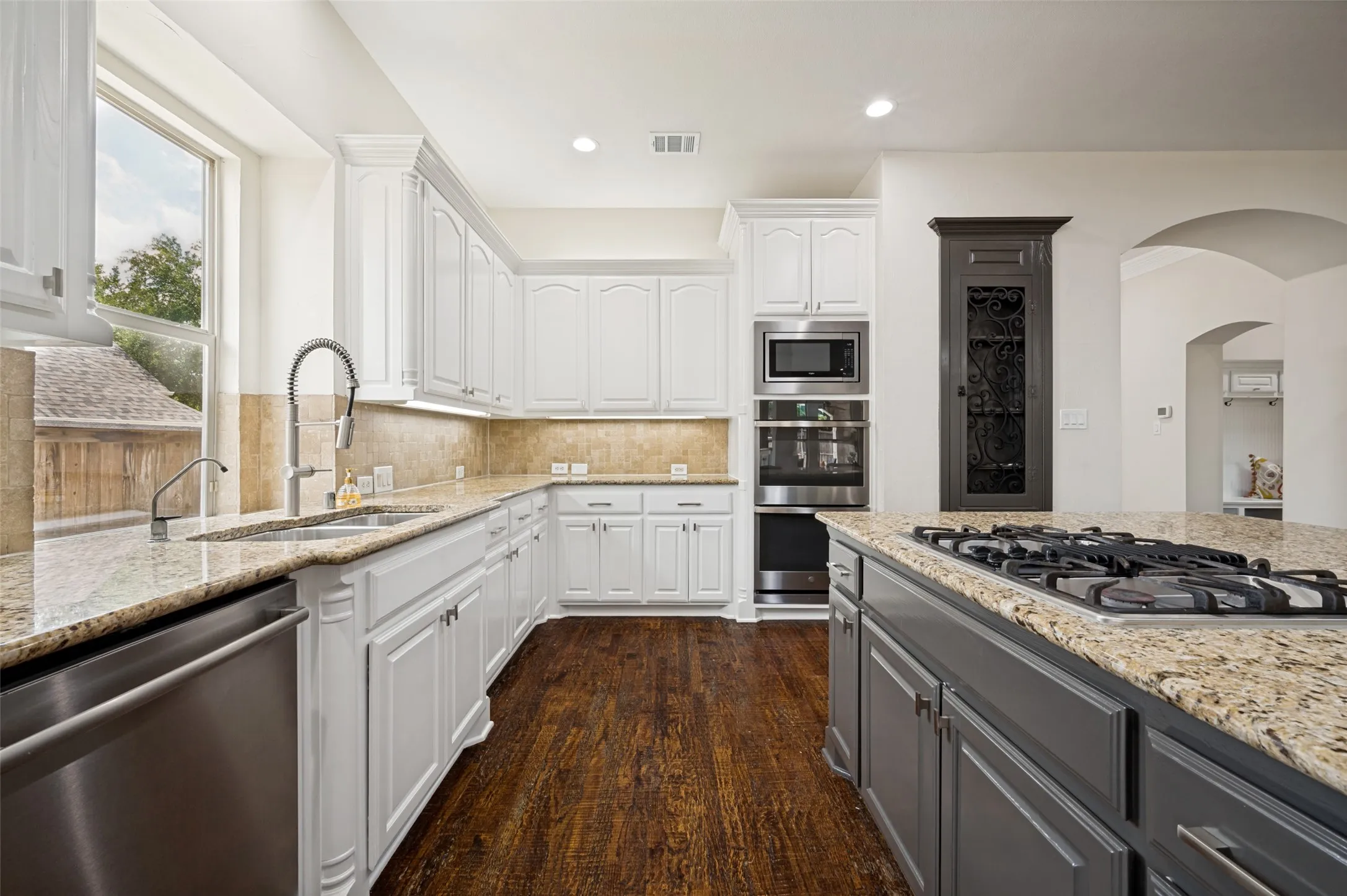 The Chef's delight kitchen features new double ovens, a gas range and spacious island.